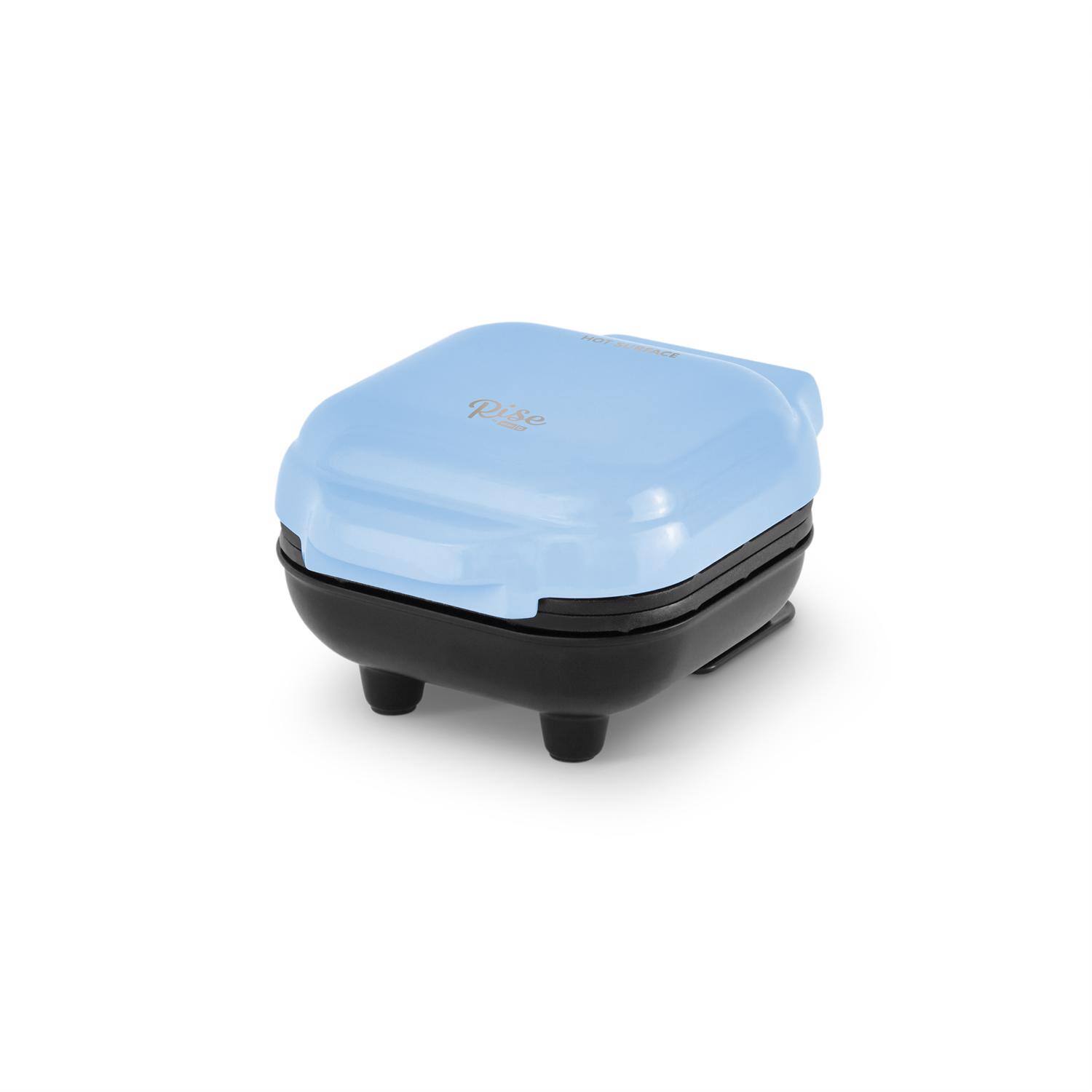 Angle. DASH - Rise by Dash 1 waffle Blue Plastic Waffle Maker - Gloss Blue.