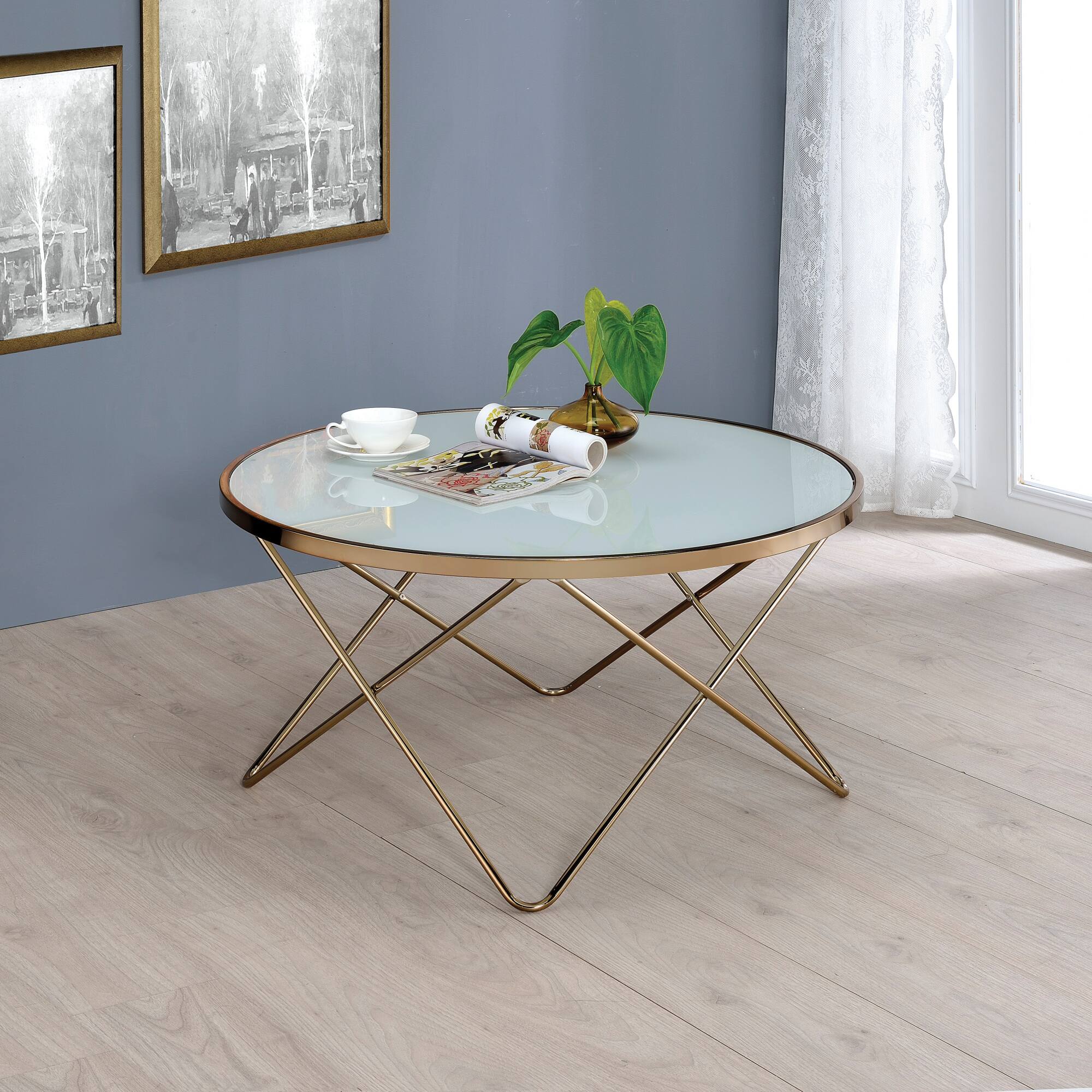 Front. GOODSILO - Frosted Glass Top and Champagne Finish Round Coffee Table with Geometric V-Shaped Metal Base - Champagne.