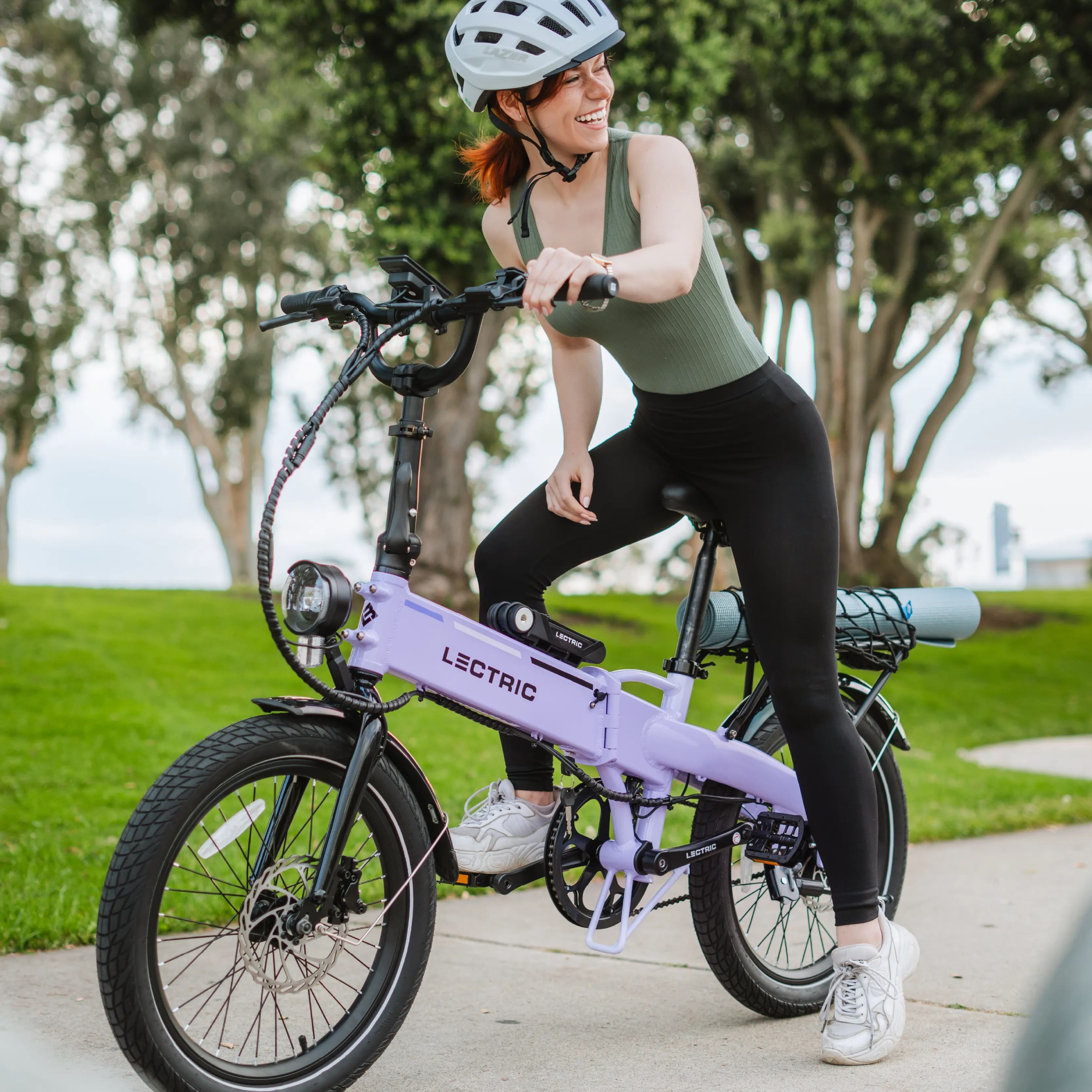 Lectric is an electric bicycle that the woman is riding.