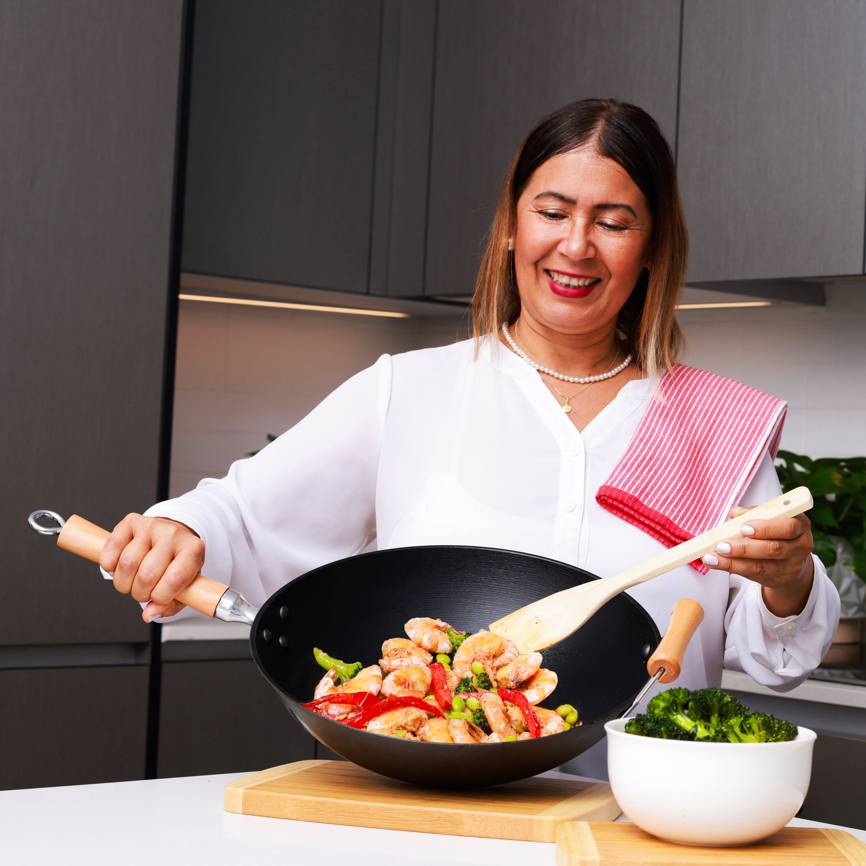 Alt View 5. Escali - Joyce Chen Professional Series 11.5-Inch Preseasoned Cast Iron Stir Fry Pan with Maple Handle - Black.