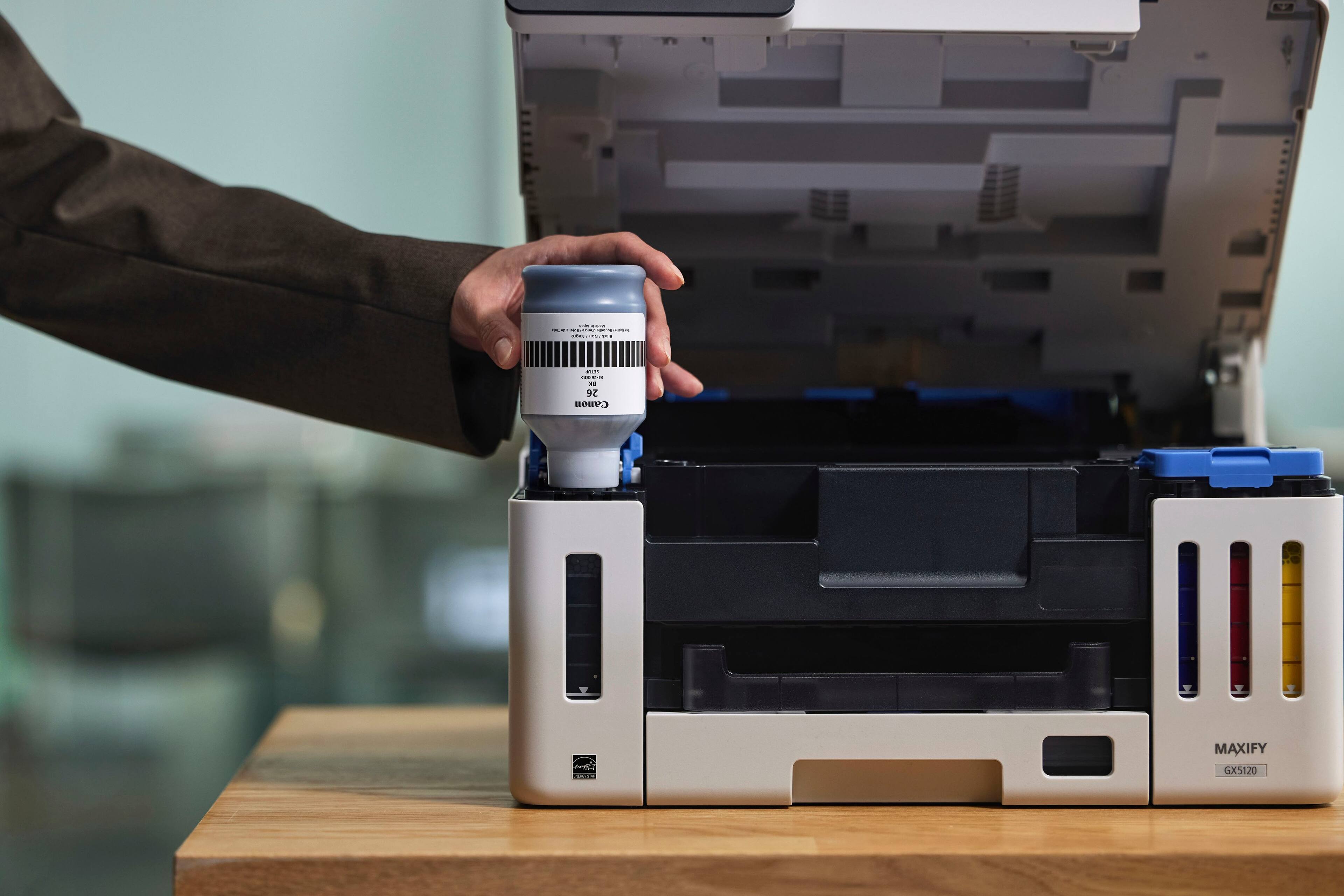 The text on the image reads "26 Camon MAXIFY GX5120".