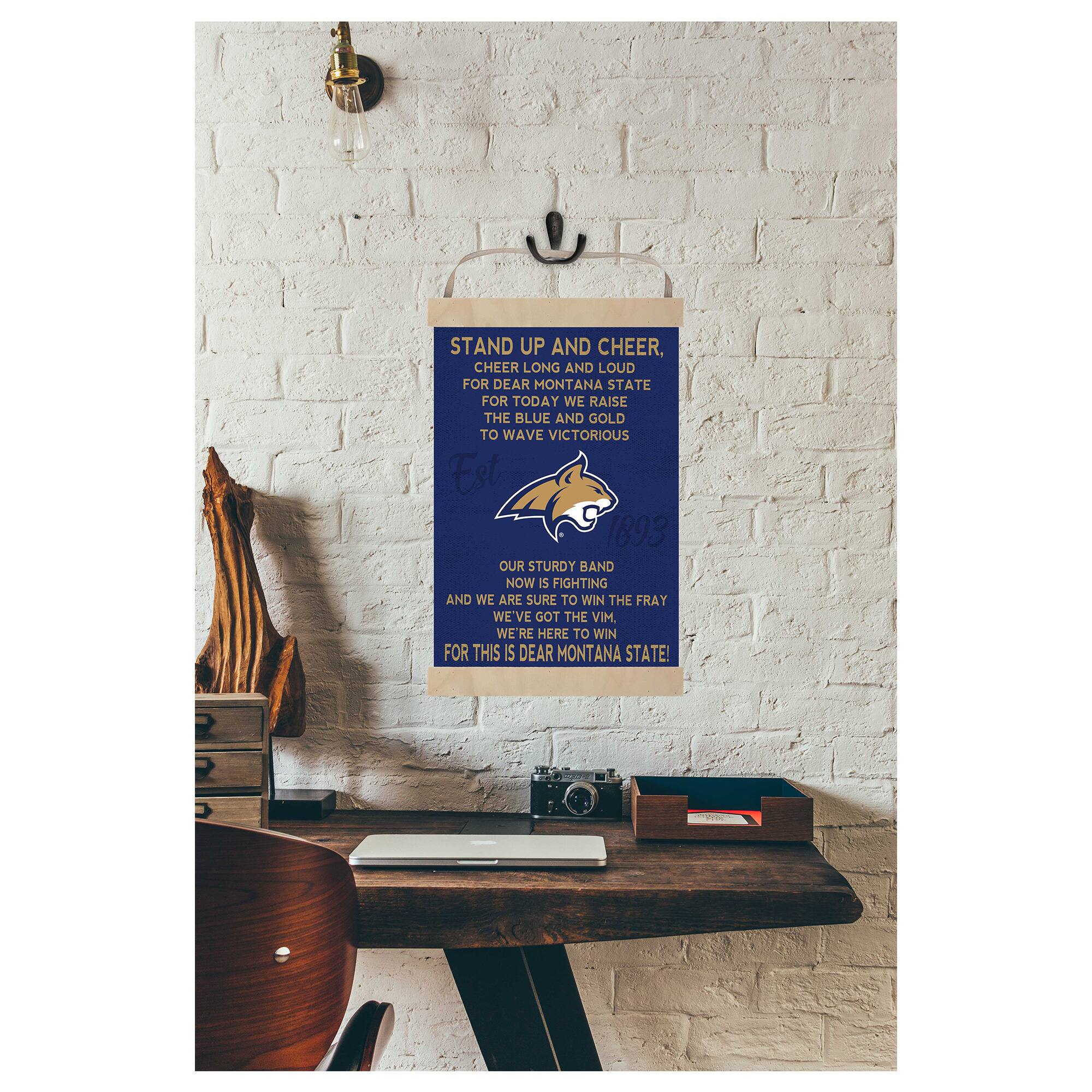 STAND UP AND CHEER,  
CHEER LONG AND LOUD FOR DEAR MONTANA STATE  
FOR TODAY WE RAISE THE BLUE AND GOLD TO WAVE VICTORIOUS  

OUR STURDY BAND NOW IS FIGHTING  
AND WE ARE SURE TO WIN THE FRAY  
WE'VE GOT THE VIM.  
WE'RE HERE TO WIN  
FOR THIS IS DEAR MONTANA STATE!  

Est 1893