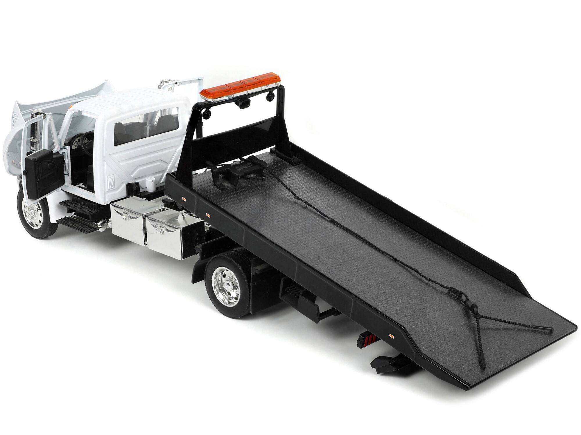 Alt View 2. Jada - International DuraStar 4400 Flatbed Tow Truck White 1/24 Diecast Model by Jada.