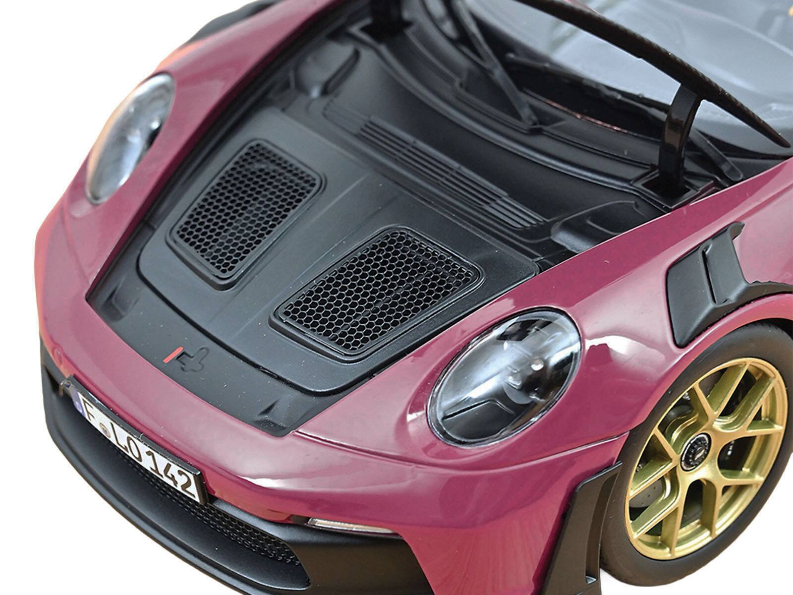 Angle. Norev - 2022 Porsche 911 GT3 RS Weissach Pack Ruby Star Red with Carbon Top and Hood Stripes 1/18 Diecast Model Car by Norev - Red.
