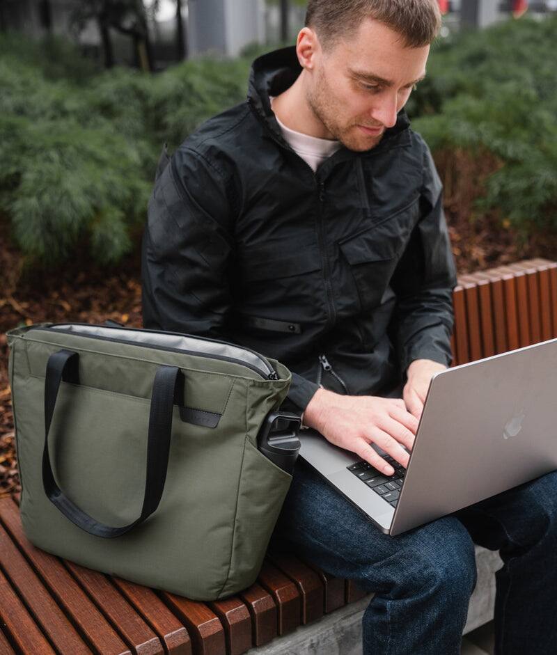 Angle. ALPAKA - Metro Tote Laptop Tote Bag for Work, Work Tote Fits 16" MacBook Pro, Side Bottle Pocket, Weather-Resistant, Key Tether - Green Axoflux 210D.