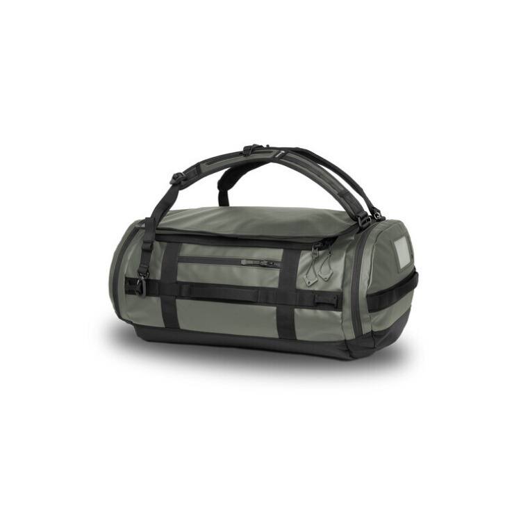 Left. WANDRD - WANDRD CARRYALL Duffel with Expandable Bottom Compartment (Wasatch Green, 60L) - Green.