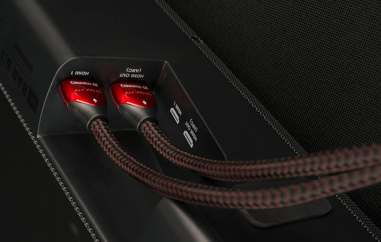 The text on the image reads:
"5.1 SOUNDBAR BAR TER L HDMI CINNAMON 48 (ARC) (ARC) OUT HDMI CINNAMON 48 (ARC) / I HDMI OUT (ARC) I HDMI."
Corrected text:
"5.1 SOUNDBAR BAR TER L HDMI CINNAMON 48 (ARC) (ARC) OUT HDMI CINNAMON 48 (ARC) / I HDMI OUT (ARC) I HDMI."