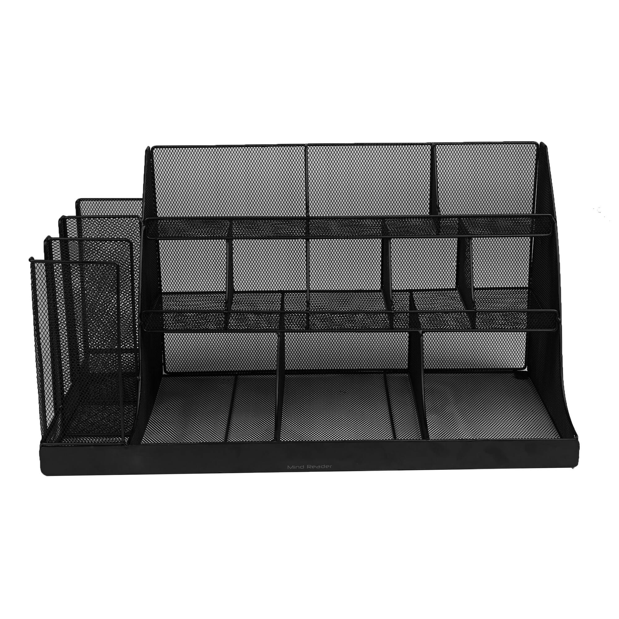 The image shows a black mesh shelf with several compartments. The shelf is designed to hold and organize various items, such as books, magazines, or other small objects. The mesh design allows for easy visibility and access to the items stored within the shelves. The shelf is placed on a white background, which helps to emphasize its structure and design.