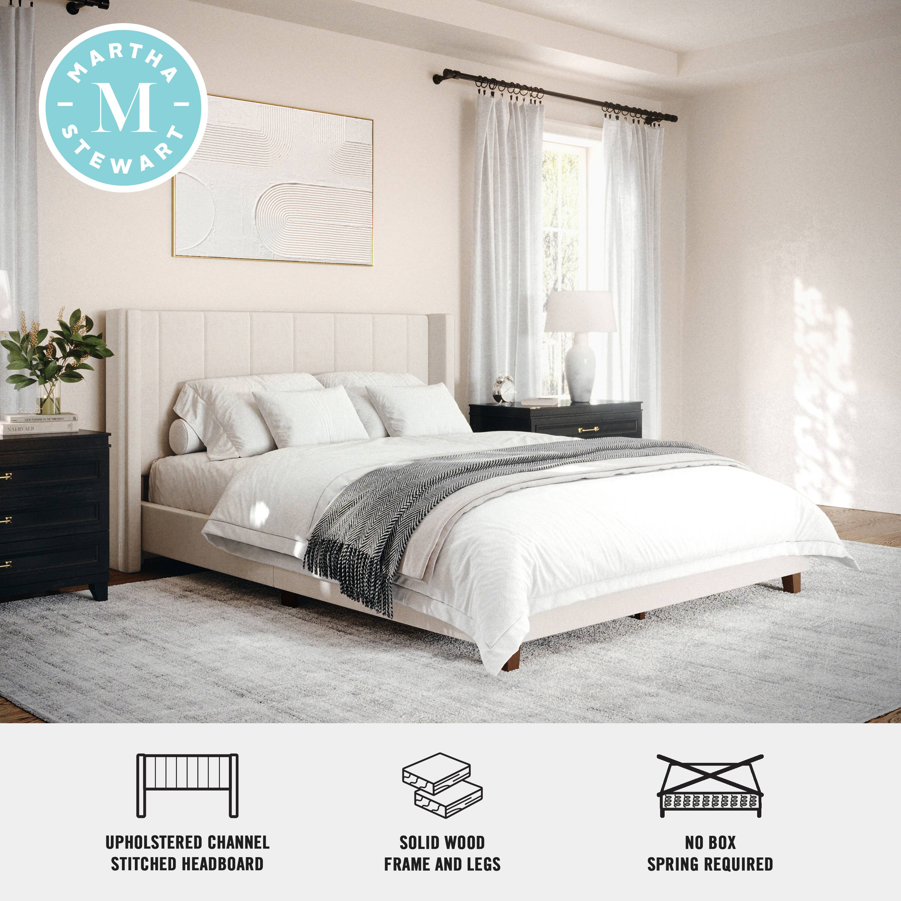 Martha Stewart is the brand associated with the bed in the image. The bed features an upholstered channel stitched headboard, a solid wood frame, and legs. Additionally, the bed does not require a box spring.
