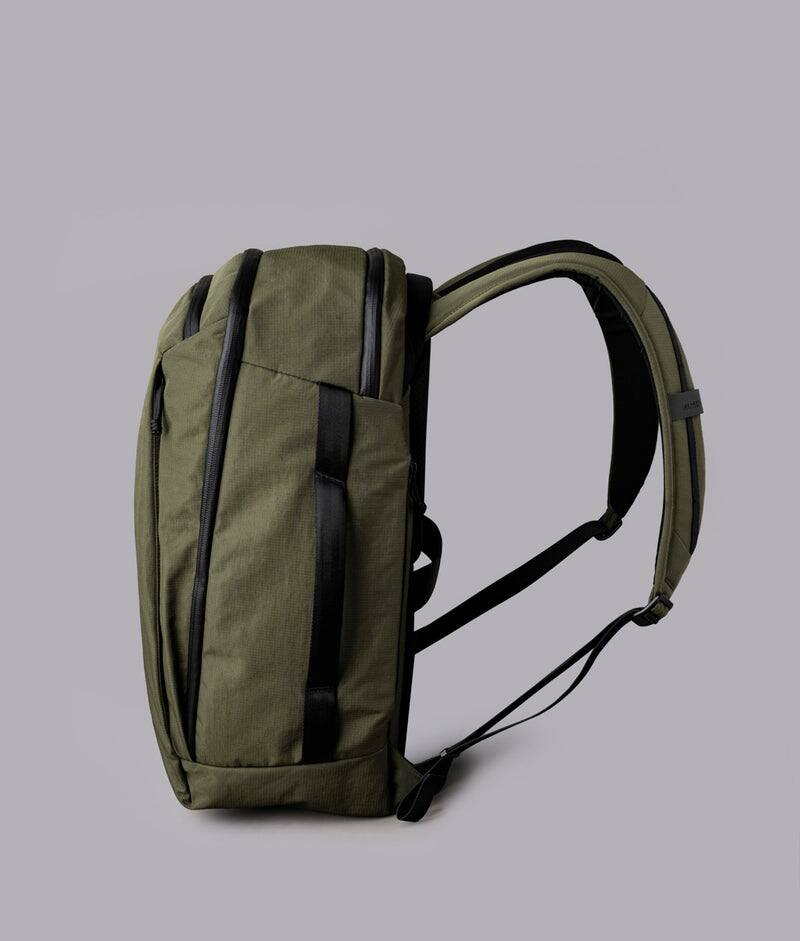 Left. ALPAKA - Traverse Backpack Laptop Backpack for Men, Backpack with Laptop Compartment (16"), Clamshell Travel Pack, Bottle Sleeve - Green Axoflux 400D Ripstop Nylon.