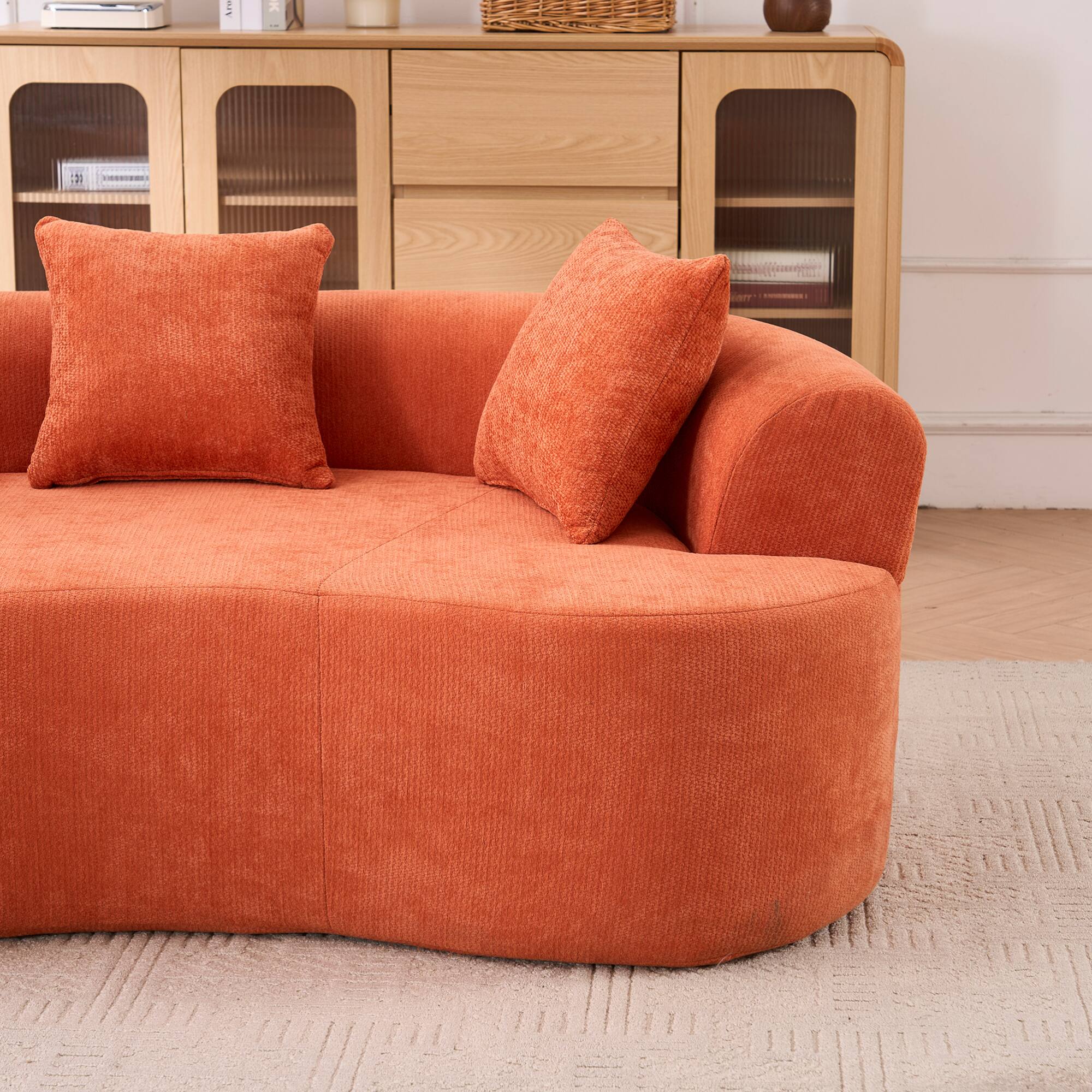 Angle. GOODSILO - Modern Crescent-Shaped Sofa with Deep Cushions and Self-Inflating Foam, Three-Seater Design for Ultimate Comfort - Orange.