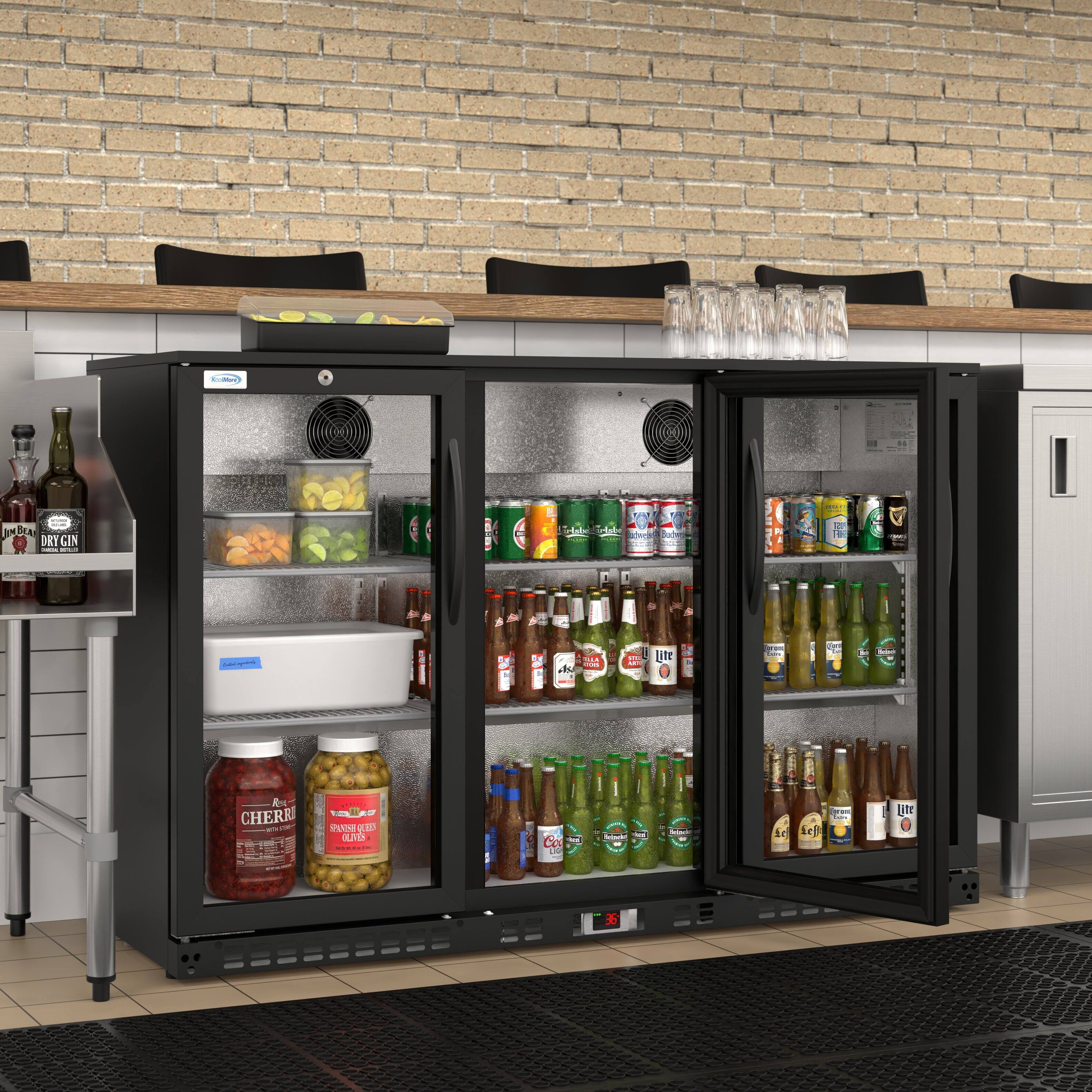 Sure, here is the corrected and grouped text from the image:

---

**Top Shelf:**
- Lind & Co. DRY GIN

**Middle Shelf:**
- CHERRI
- SPANISH GREEN OLIVES

**Bottom Shelf:**
- Various bottles of beer and soda

**Temperature Display:**
- 39°F

---