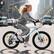 Angle. Anysun - Kids Bike for Ages 6-12 - 20 Inch, 7-Speed Steel Frame, Dual Disc Brakes, 20x1.75 Inch Tires - Silver.