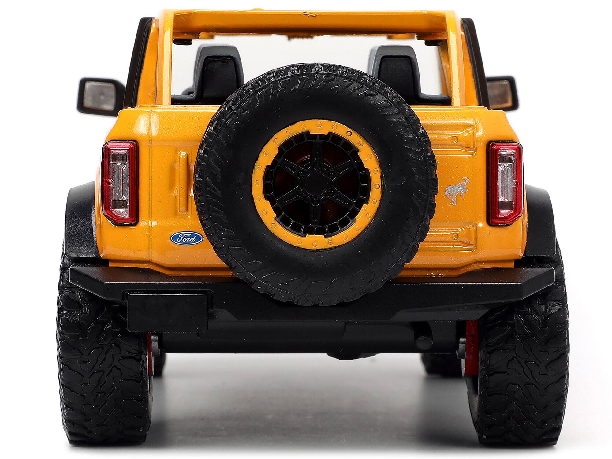 Alt View 5. Jada - 2021 Ford Bronco Orange Metallic with Extra Wheels "Just Trucks" Series 1/24 Diecast Model Car by Jada.