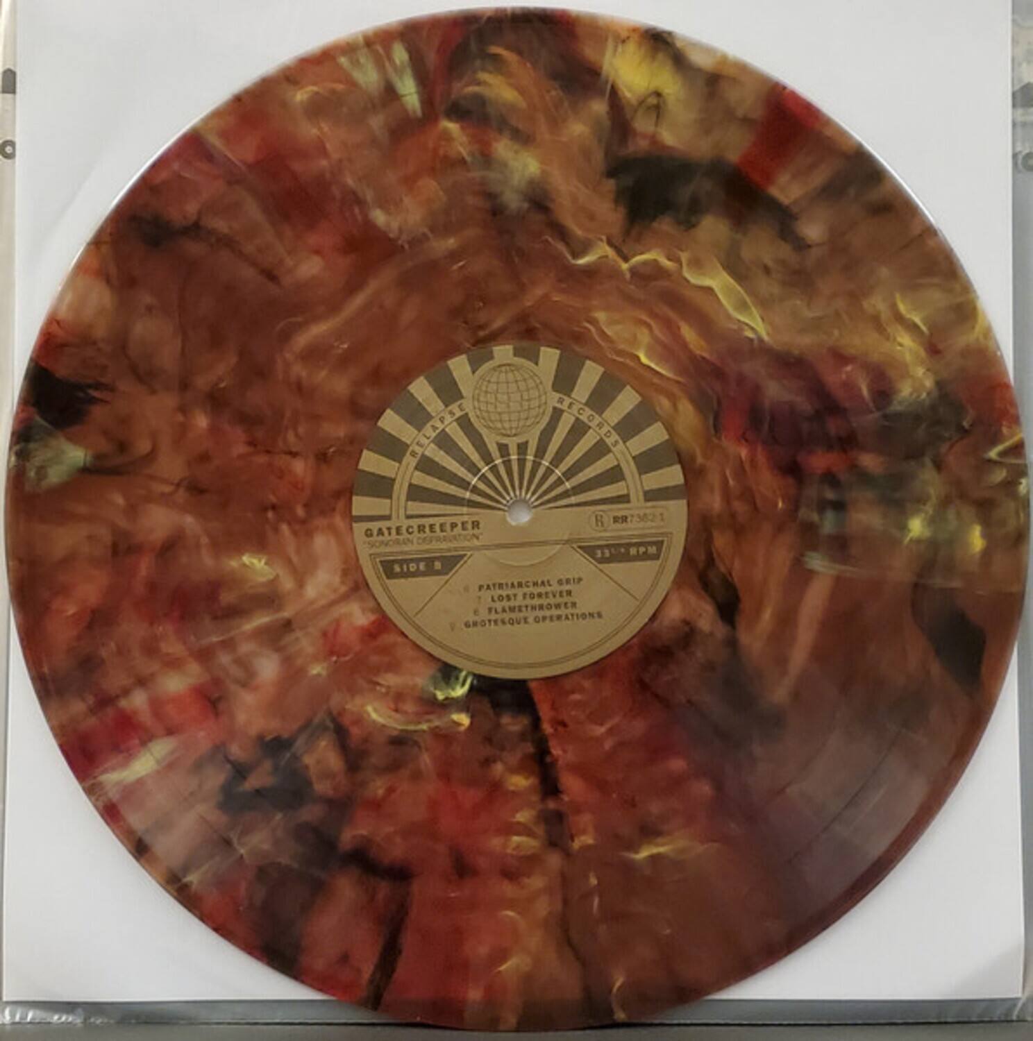 RELAPSE RECORDS  
H 73621  

GATECREEPER  
DEPRAVATION  
"SONORIN"  
33 1/3 RPM  
SIDE A  
PATRIARCHAL GRIP  
LOST FOREVER  
FLAMETHROWER  
GROTESQUE OPERATIONS  

GATECREEPER  
DEPRAVATION  
"SONORIN"  
33 1/3 RPM  
SIDE B  
PATRIARCHAL GRIP  
LOST FOREVER  
FLAMETHROWER  
GROTESQUE OPERATIONS