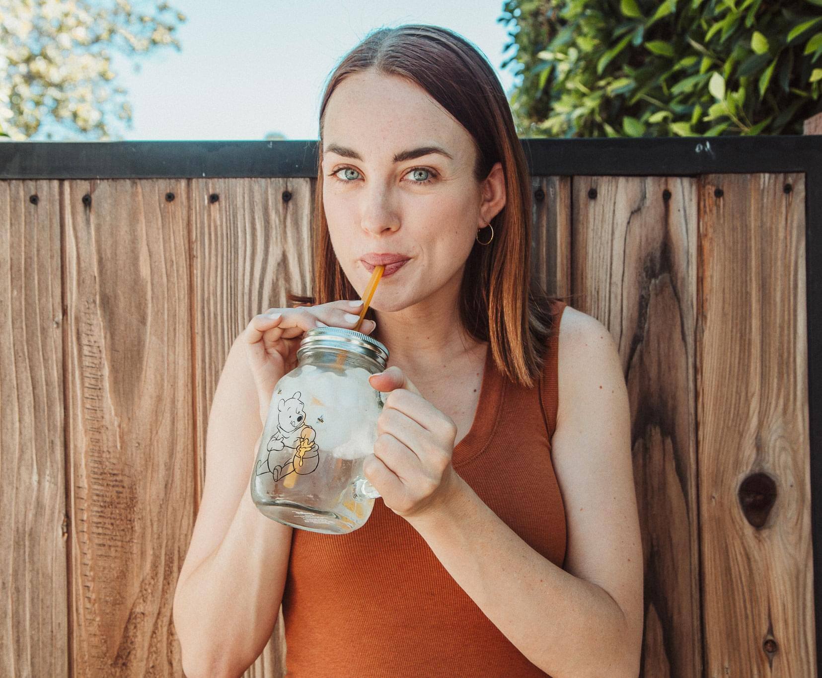 Alt View 3. Disney - Winnie the Pooh Sweet as Can Bee 21 Ounce Glass Mason Jar With Lid and Straw - Yellow.
