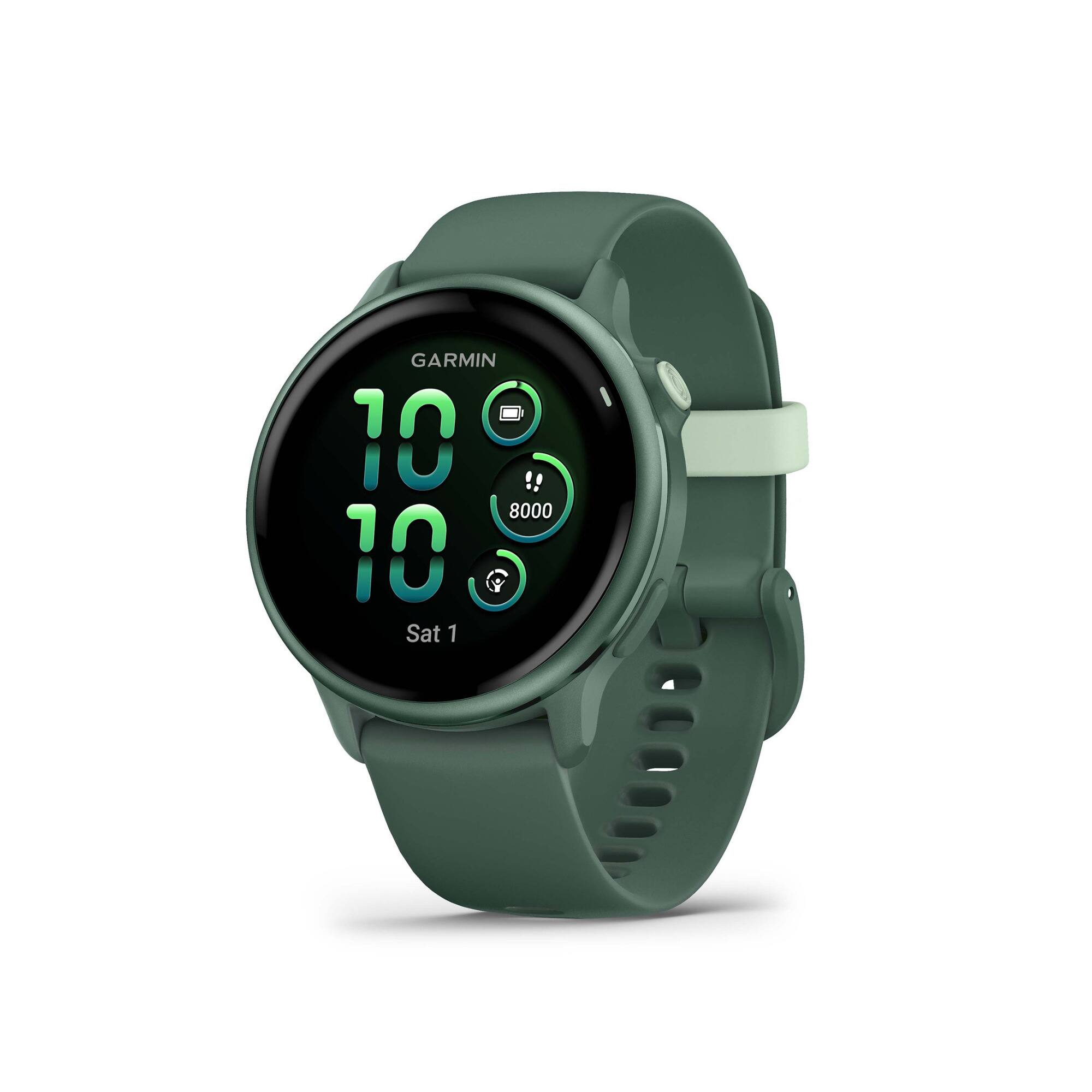 The text on the image reads "GARMIN 10 8000 10 Sat 1". This information suggests that the watch is a Garmin brand, with a display showing the time as 10:10. The watch also has a heart rate monitor and is designed for running. The watch is green in color, and the band is white.