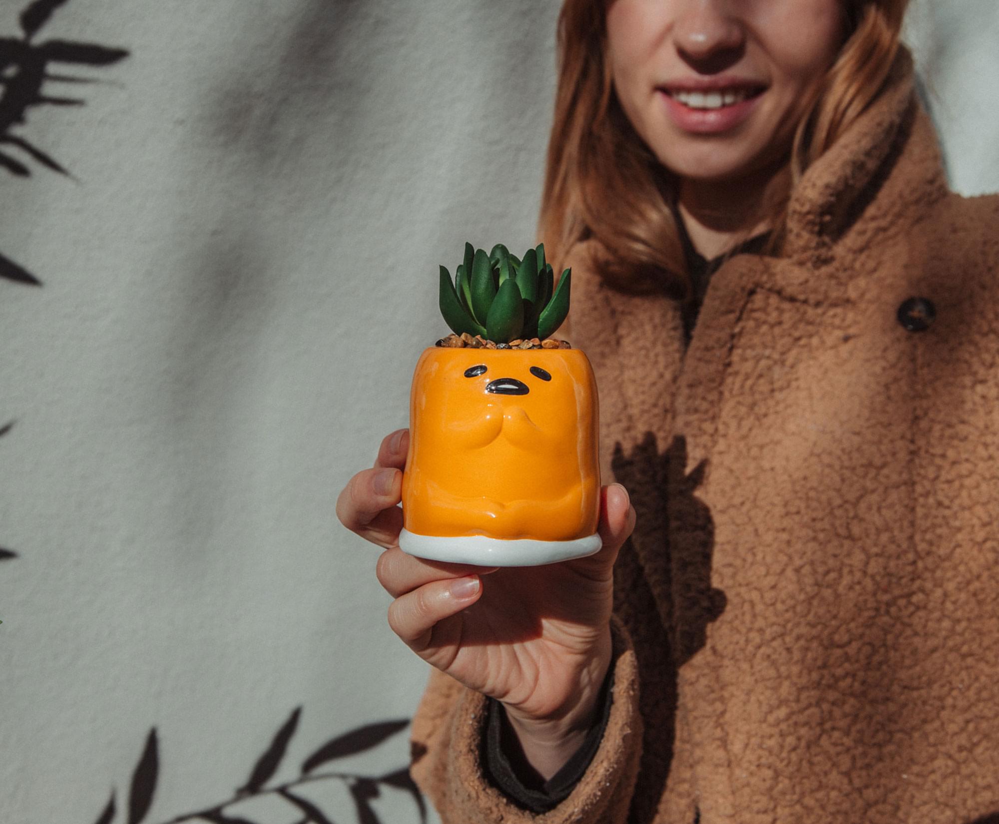 Alt View 3. Silver Buffalo - Sanrio Gudetama Meditation 3-Inch Mini Planter With Artificial Succulent - Yellow.