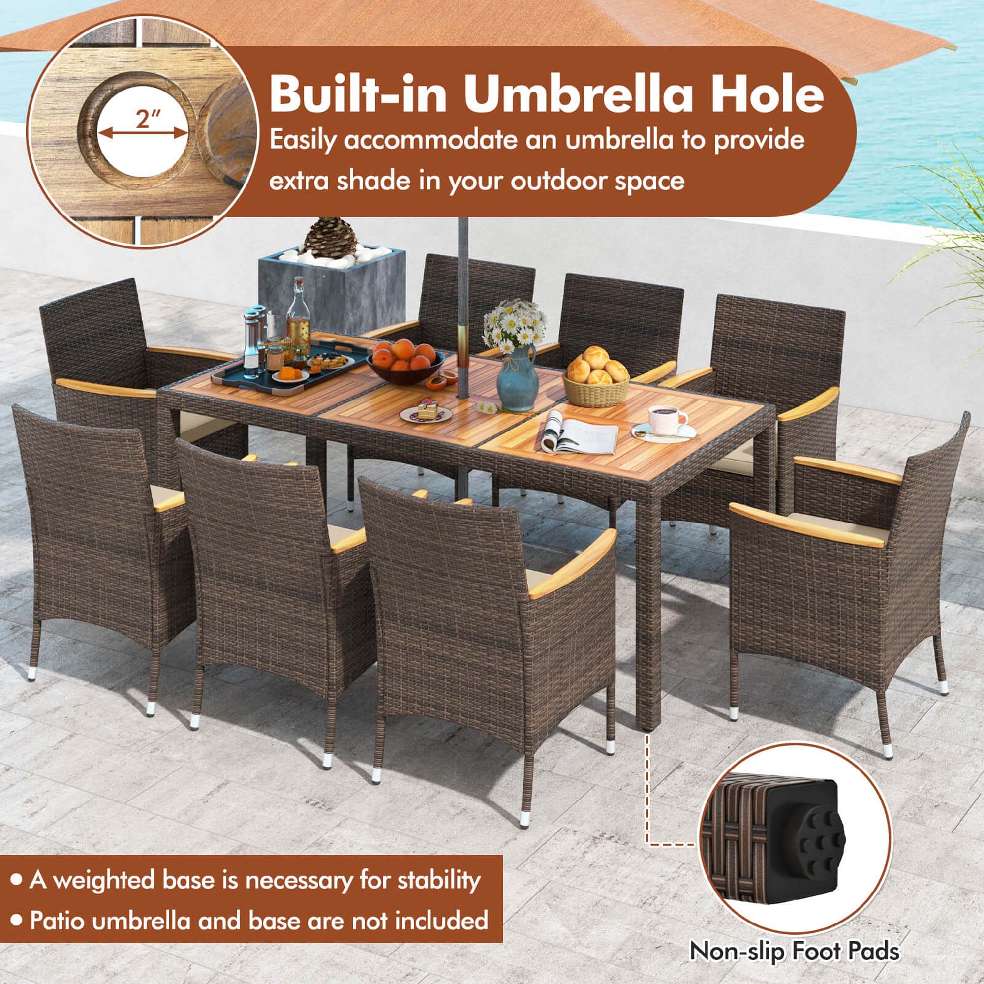 The image features a patio table and chairs set up outside, with a built-in umbrella hole in the middle of the table. The table is surrounded by chairs, and there is a potted plant nearby. The umbrella hole is designed to easily accommodate an umbrella, providing extra shade in the outdoor space. A weighted base is necessary for stability, and the patio umbrella and base are not included. The table also has non-slip foot pads for added safety and stability.