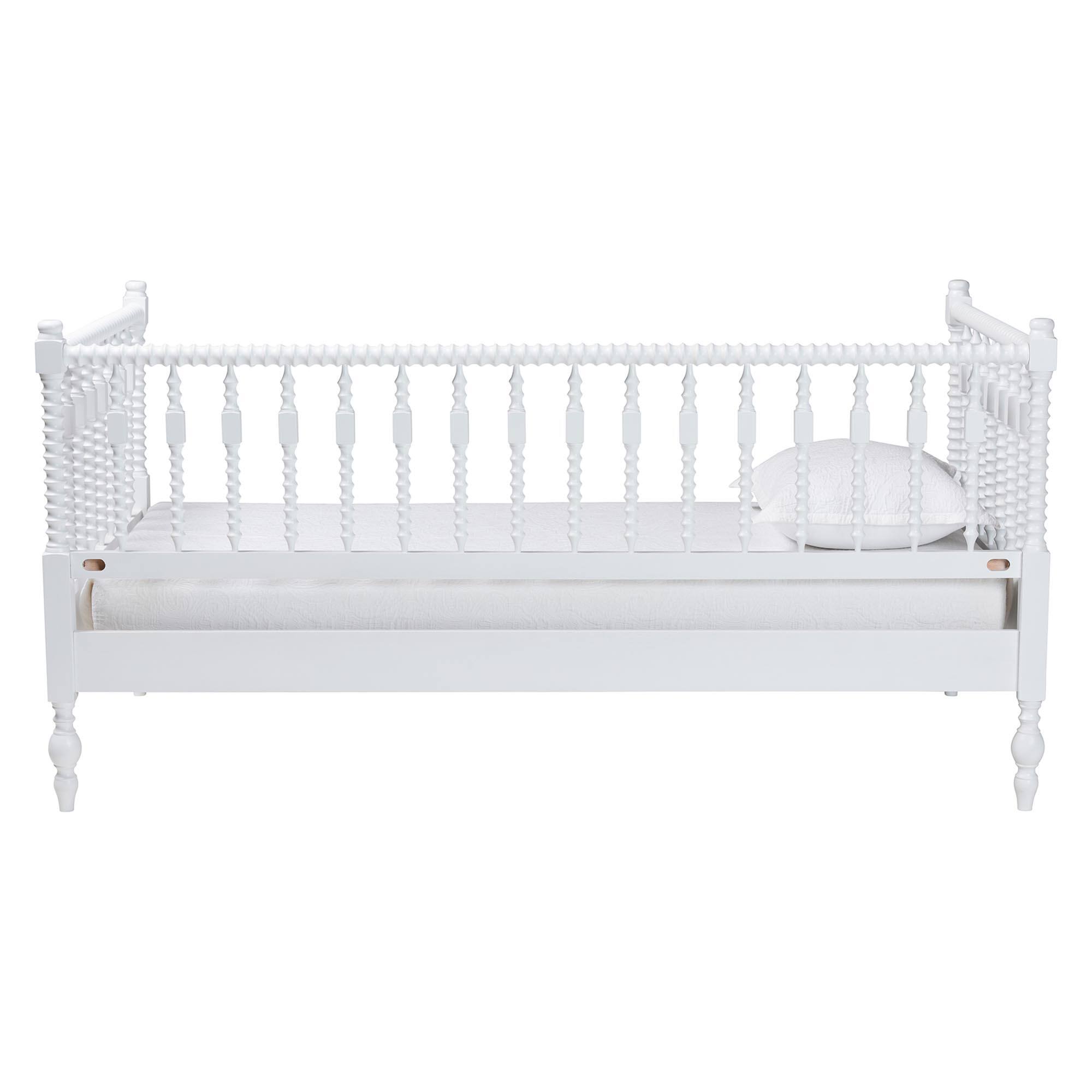 Left. Baxton Studio - Callison Spindle Daybed - Turned Farmhouse Sofa Bed with Spoked Frame Border, Twin - White.