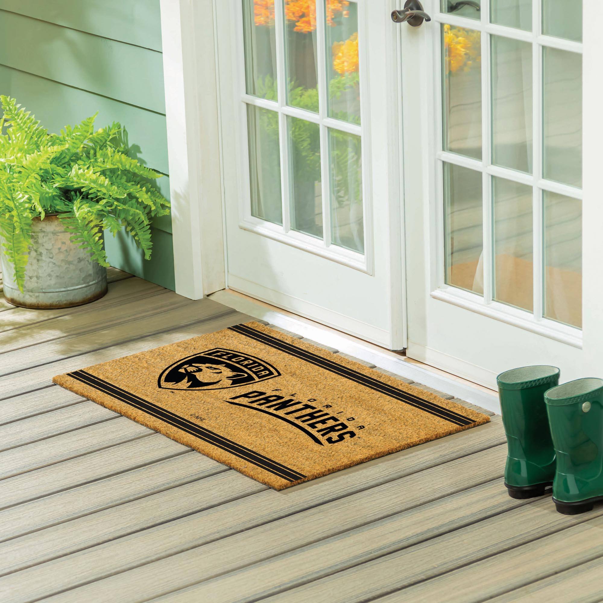 The text on the doormat reads: "CAROLINA PANTHERS"