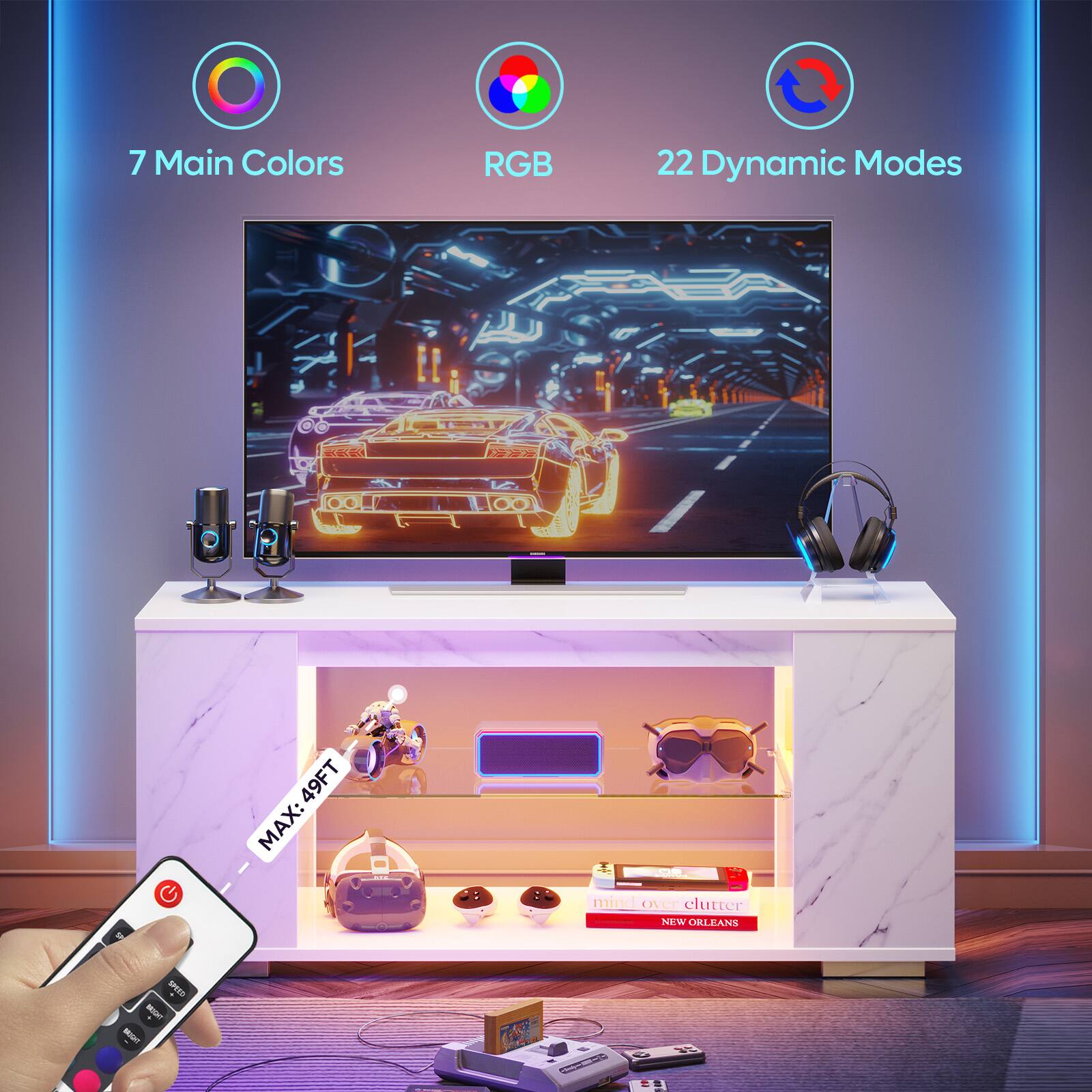 The image features a flat screen TV with a remote control in the foreground. The TV is described as having 7 main colors, RGB, and 22 dynamic modes. The remote control is being used to operate the TV, and there is a bookshelf nearby. The TV is placed on a stand, and the image also includes a car and a book.