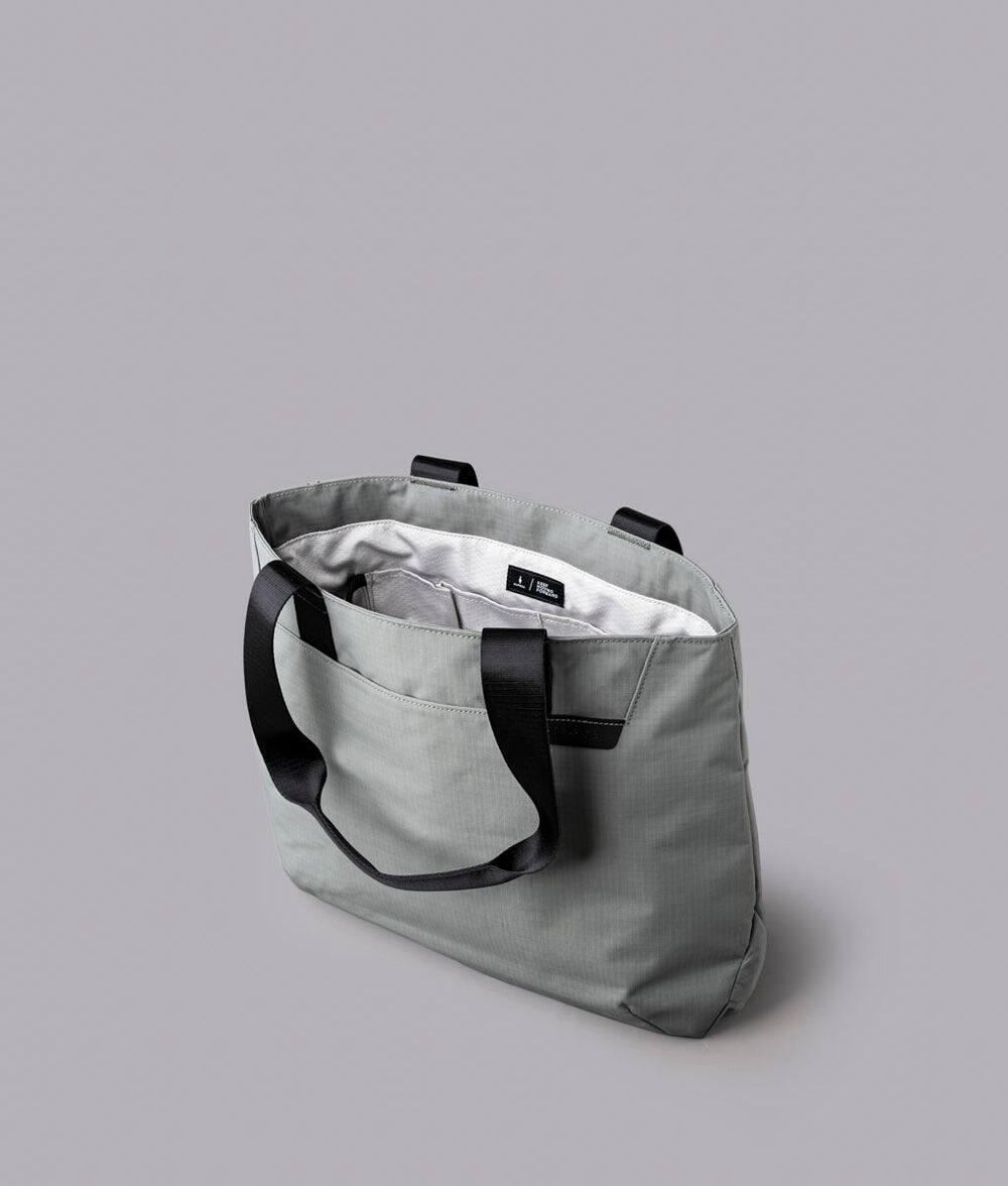 Alt View 2. ALPAKA - Tote Bag Minimalist EDC Travel Tote,14.5L , 2 Bottle Sleeves, Front/Back Slip Pockets, Magnetic Open-Top (No Zipper) - Grey/G Axoflux 210D.
