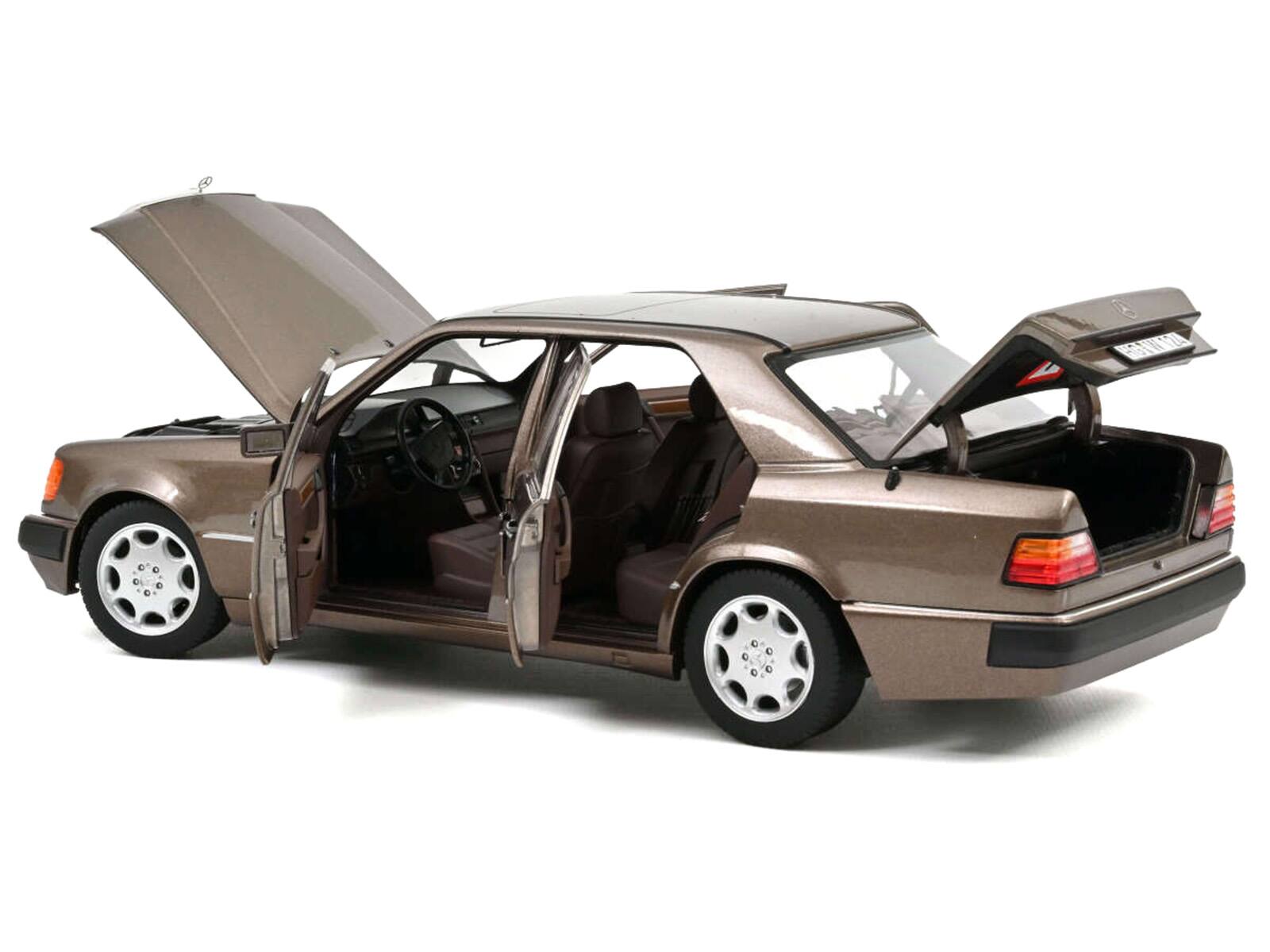 Alt View 1. Norev - 1990 Mercedes-Benz 500 E Impala Brown Metallic 1/18 Diecast Model by Norev.