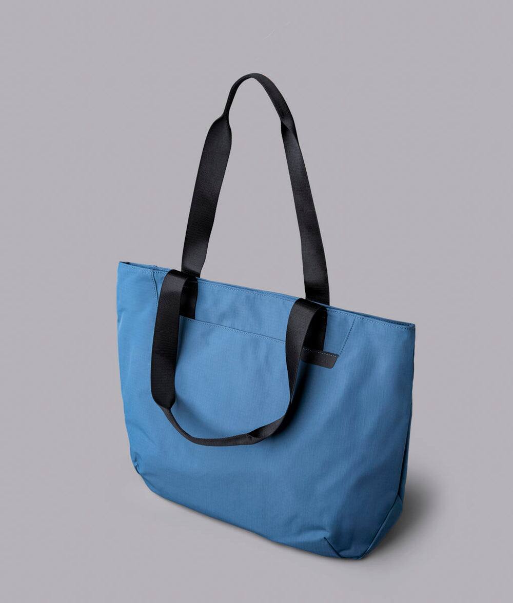 Alt View 1. ALPAKA - Elements Tote 20L Laptop Tote Bag with Padded 16" Sleeve,Open Top with Magnetic Closure - Blue Axoflux 210D.