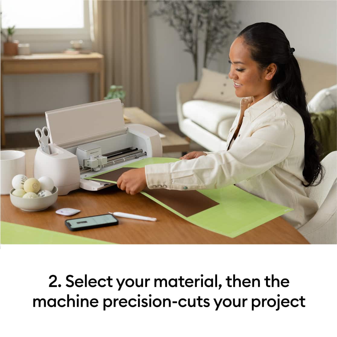 2. Select your material, then the machine precision-cuts your project.