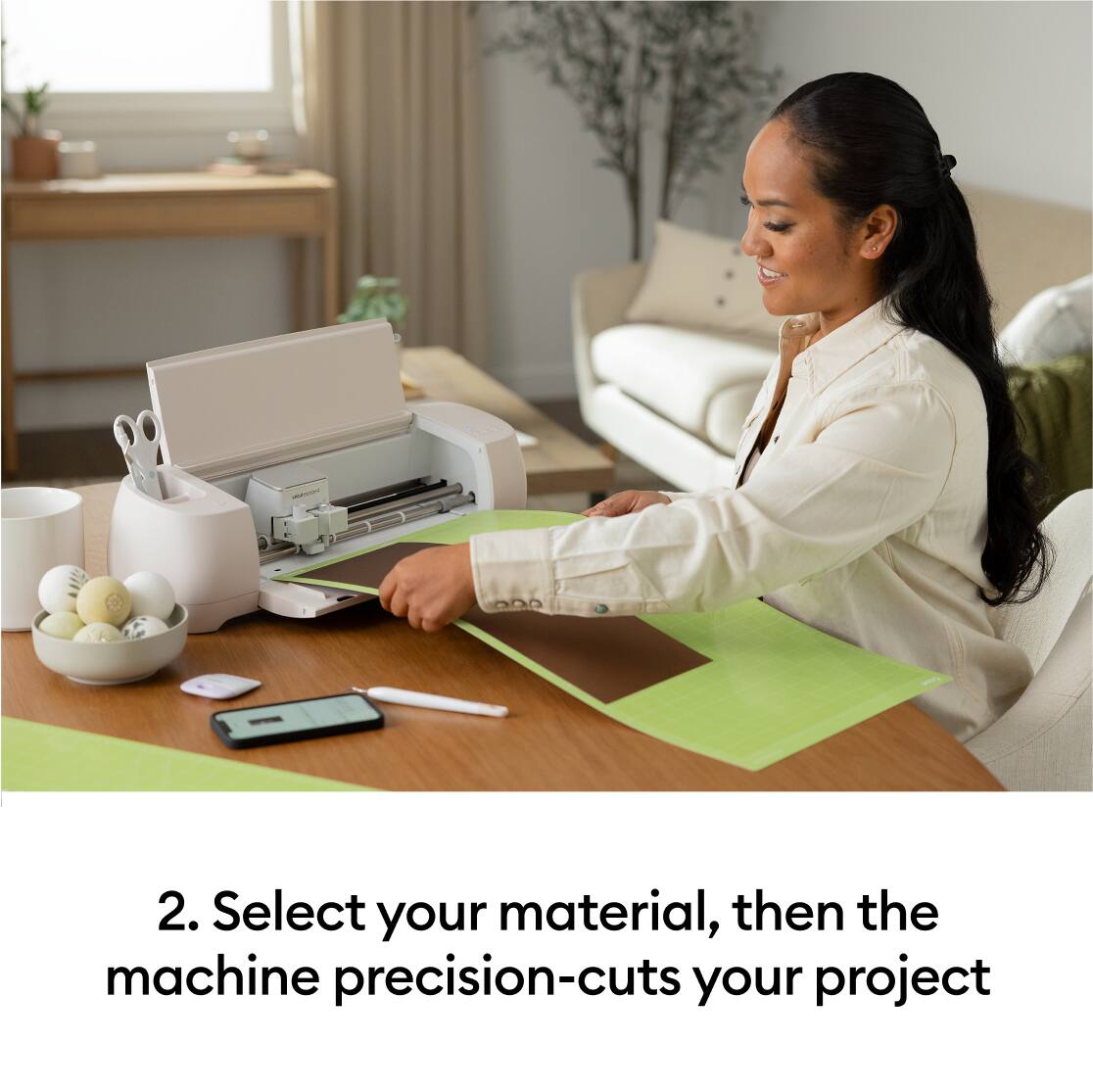2. Select your material, then the machine precision-cuts your project.