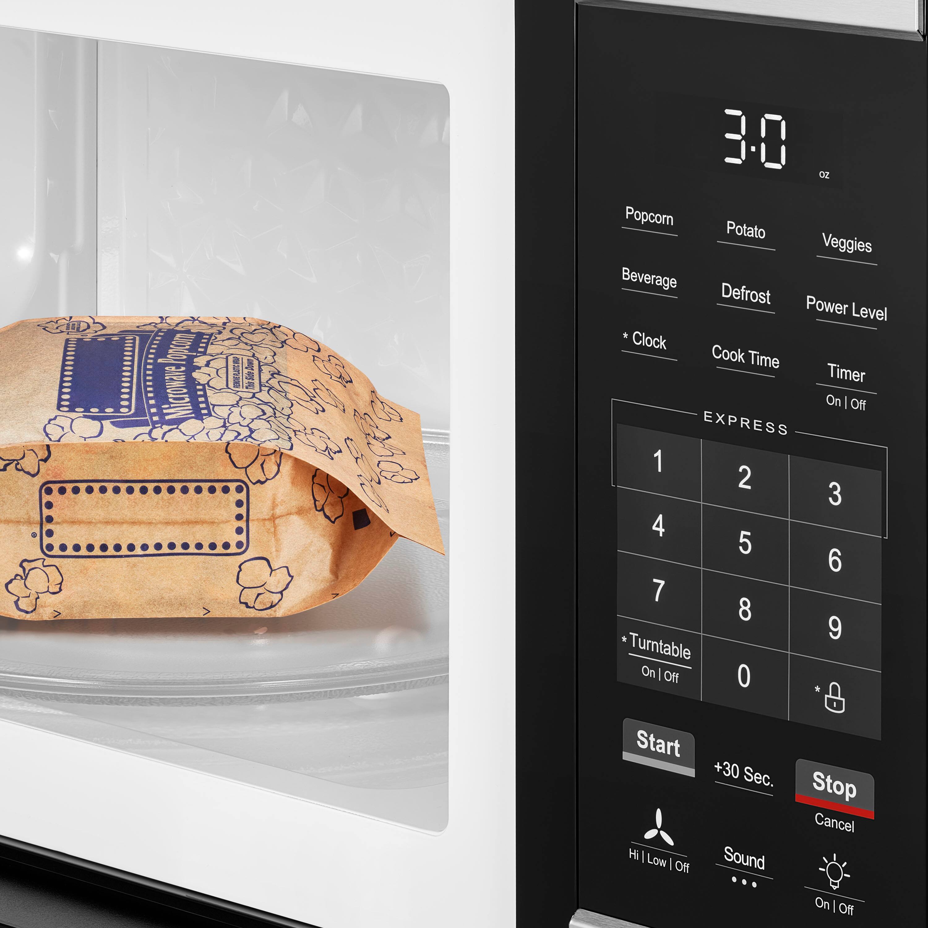 30 oz Popcorn Potato Veggies Beverage Defrost Power Level Clock Cook Time Timer On/Off EXPRESS 1 2 3 4 5 6 7 8 9 Turntable On/Off 0 Start +30 Sec. Sound Stop Cancel On/Off Hi Low On/Off
