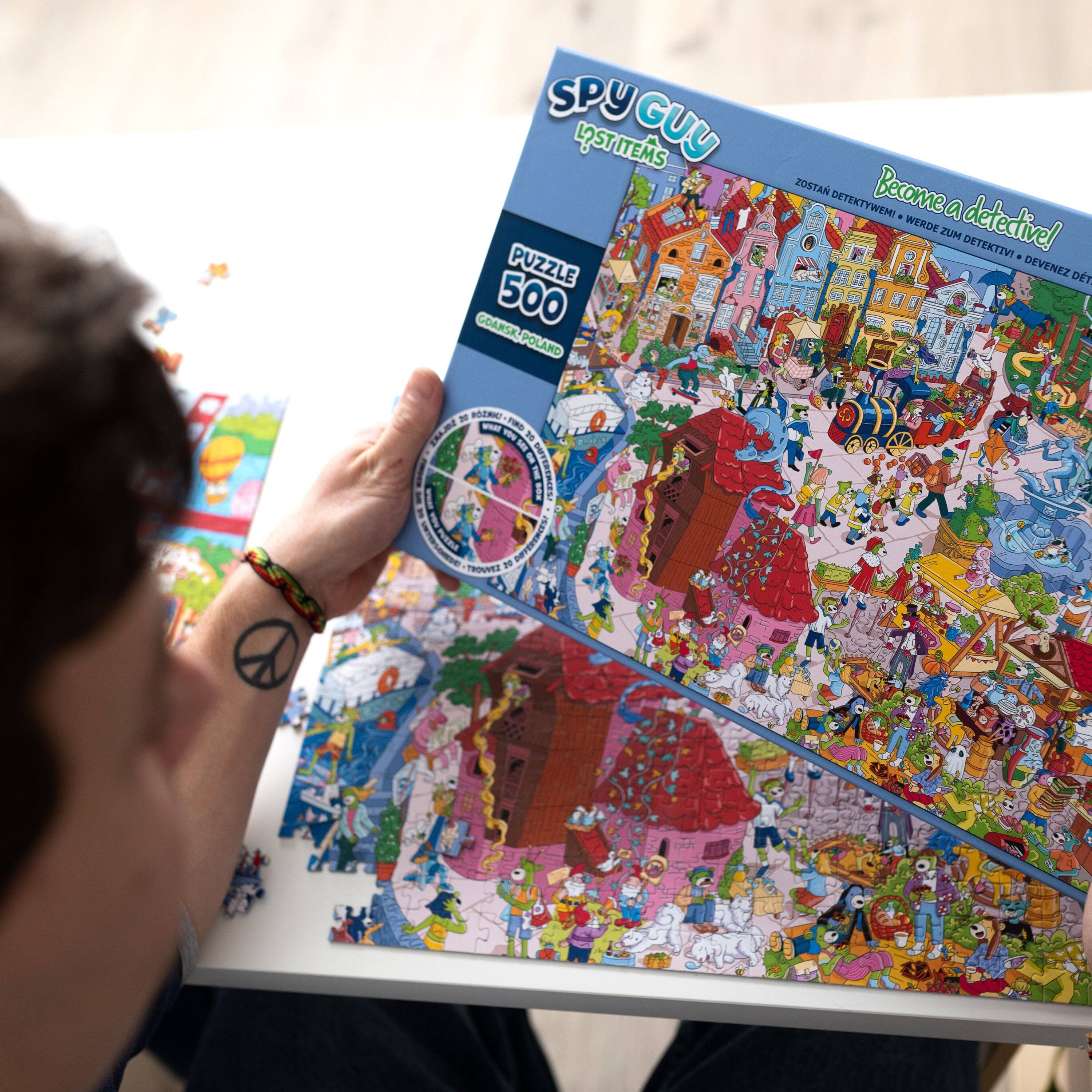 Sure, here is the corrected and grouped text from the image:

---

**SPY GUY**  
**LIST ITEMS**

**Become a detective!**  
**ZOSTAN DETEKTYWEM!**  
**WERDE ZUM DETEKTIV!**  
**DEVENEZ DETECTIVE!**

**PUZZLE 500**  
**GÓREK-POLSKA**

---

This text is from the packaging of a puzzle game called "Spy Guy List Items."