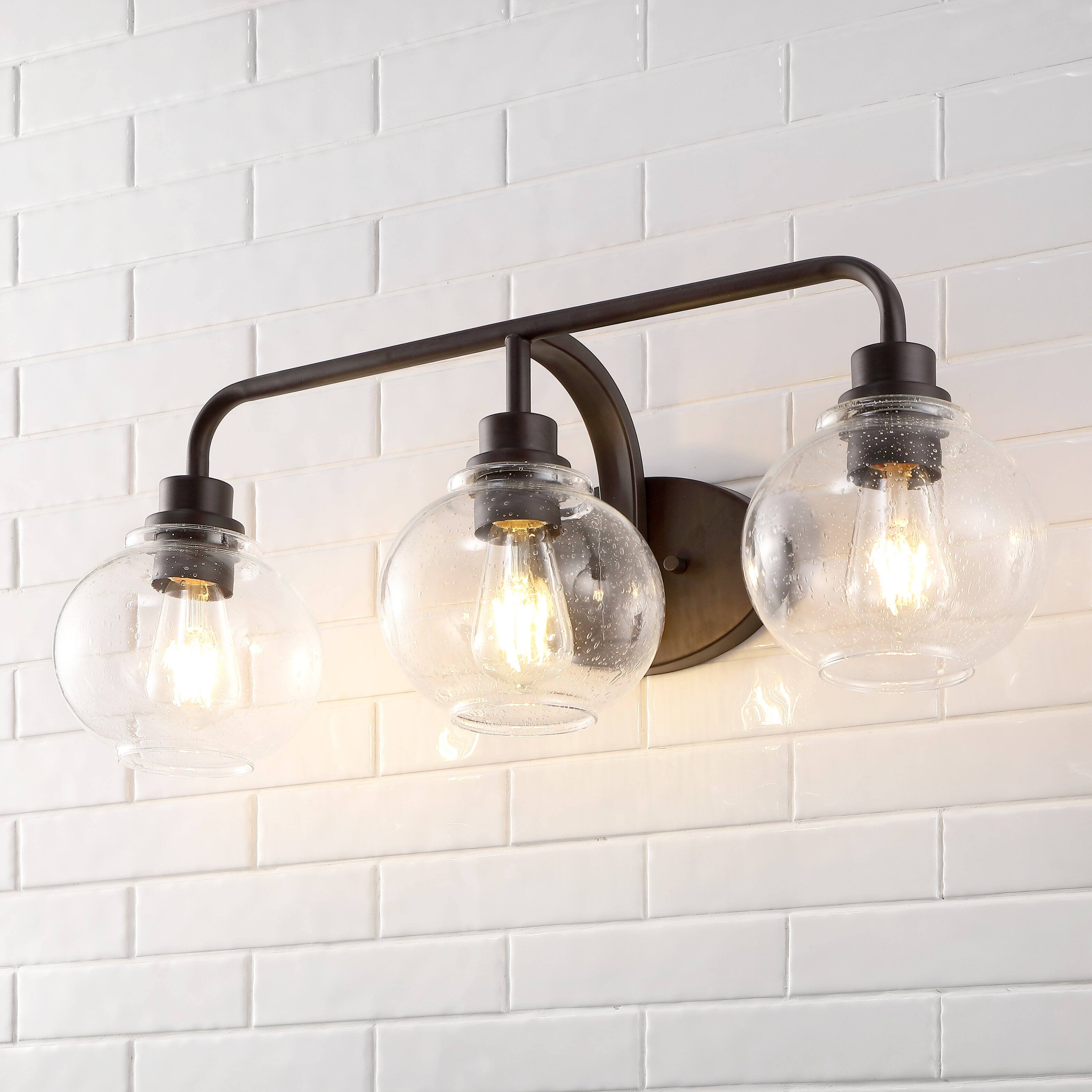 Alt View 1. Jonathan Y - Sandrine 26.25" 3-Light Iron/Seeded Glass Cottage Rustic LED Vanity Light, Oil Rubbed Bronze - Oil Rubbed Bronze.