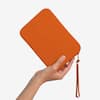 Front. Strapsicle - Strapsicle Clutch for E-Readers - Kindle, Paperwhite, Kobos, Nook - Anti-Dust Coating - Burnt Orange.