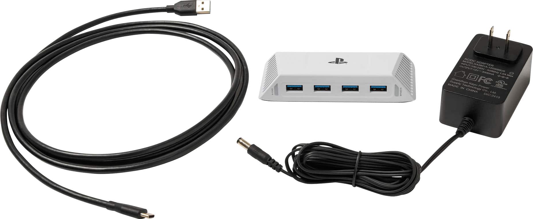 The image shows a white box with a black cord plugged into it, along with a charger and a power supply. The text on the image reads "ANMIEE AC/DC Input AUTOMATION K KA3601A-1203000 ADAPTER ER OUTPUT II 2000ma F.O.A. Made in China."