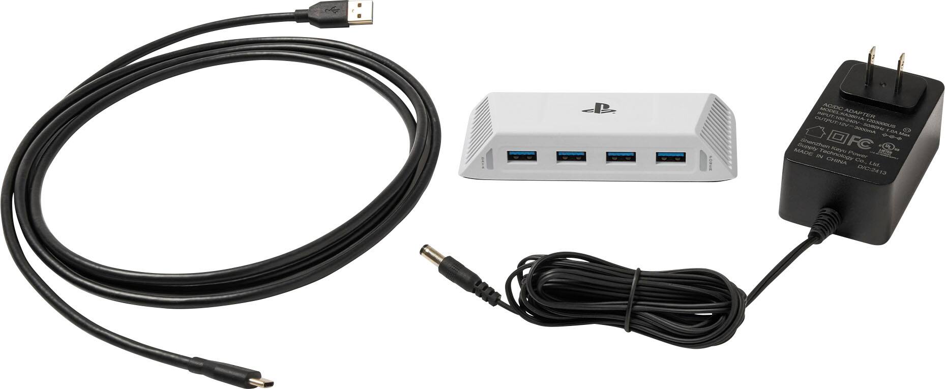 The image shows a white box with a black cord plugged into it, along with a charger and a power supply. The text on the image reads "ANMIEE AC/DC Input AUTOMATION K KA3601A-1203000 ADAPTER ER OUTPUT II 2000ma F.O.A. Made in China."