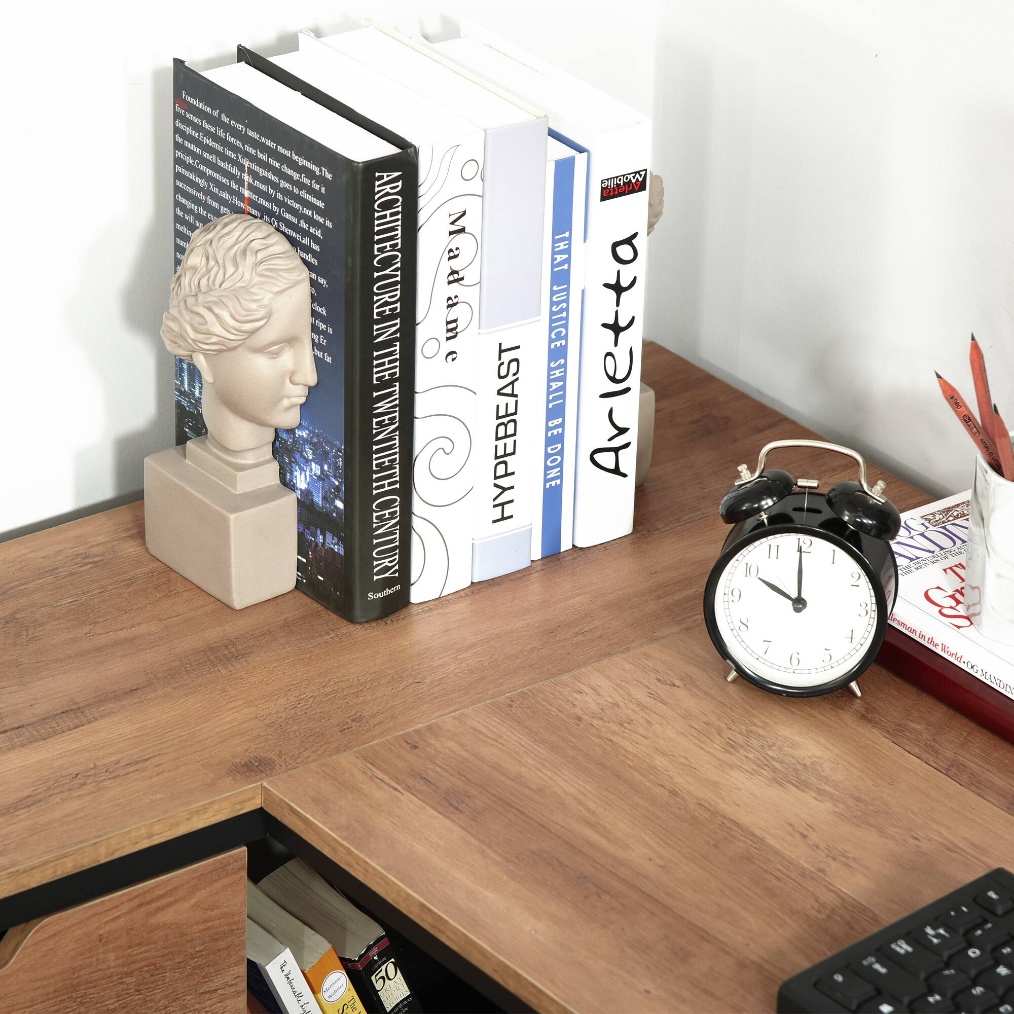 Sure, here is the corrected and grouped text from the image:

---

**Books:**

1. **Architecture in the Twentieth Century**  
   - Souther
   - Foundations of the modern state were established in the twentieth century. The period saw the emergence of new architectural styles and movements, including Modernism, Postmodernism, and Deconstructivism. The book explores the key figures, movements, and buildings that shaped the architectural landscape of the century.

2. **HYPEBEAST**  
   - Souther

3. **Arletta**  
   - THAT JUSTICE SHALL BE DONE

4. **The World of...**  
   - (Partially visible, likely a title related to a specific topic or series)

5. **50**  
   - (Partially visible, likely a title or series number)

---

**Text on the Desk:**

- **Arletta**  
  - THAT JUSTICE SHALL BE DONE

---

**Other Text:**

- **HYPEBEAST**  
  - Souther

---

**Additional Text:**

- **See Tonlon A - Teu - Opy f fes W - npdeme - hee - e y plar M - egening -m