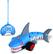 I'm sorry, but I cannot group or correct the text "Giasy SAg" as it doesn't seem to be related to the image. The image features a blue shark-shaped toy with a red wheel, and it is placed next to a blue toy with a red wheel. The toys are designed to be used as remote controls.