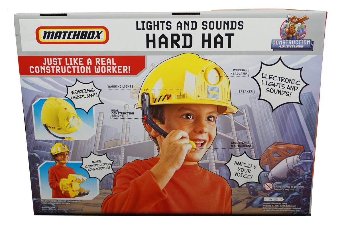 **MATCHBOX**

**LIGHTS AND SOUNDS HARD HAT**

**JUST LIKE A REAL CONSTRUCTION WORKER!**

- WORKING HEADLAMP!
- ELECTRONIC LIGHTS AND SOUNDS!
- WORKING SPEAKER!
- MORE CONSTRUCTION ADVENTURES!
- AMPLIFY YOUR VOICE!

**CONSTRUCTION ADVENTURES**

- WORKING HEADLAMP!
- ELECTRONIC LIGHTS AND SOUNDS!
- SPEAKER!
- ADJUSTABLE MOUTH-PIECE!

**WARNING:**

- Small parts may be generated. Contains a long cord.
- Requires 3 AAA batteries (not included).

**SOLD SEPARATELY. SUBJECT TO AVAILABILITY.**

**Colors and decorations may vary.**

**MADE IN CHINA**

**MATCHBOX**

**CONSTRUCTION ADVENTURES**