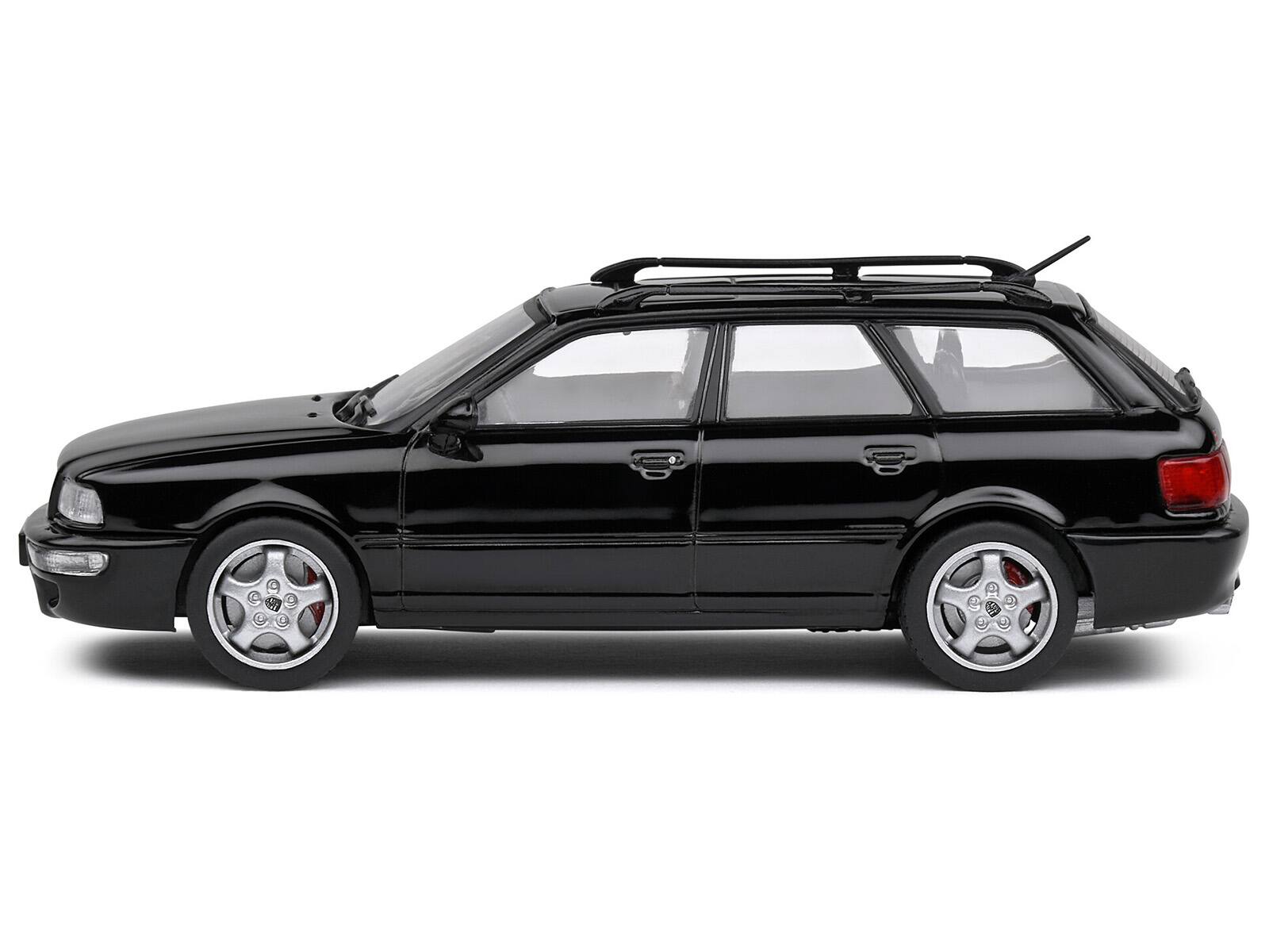 Angle. Solido - 1995 Audi Avant RS2 Brilliant Black with Roofrack 1/43 Diecast Model Car by Solido - Black.