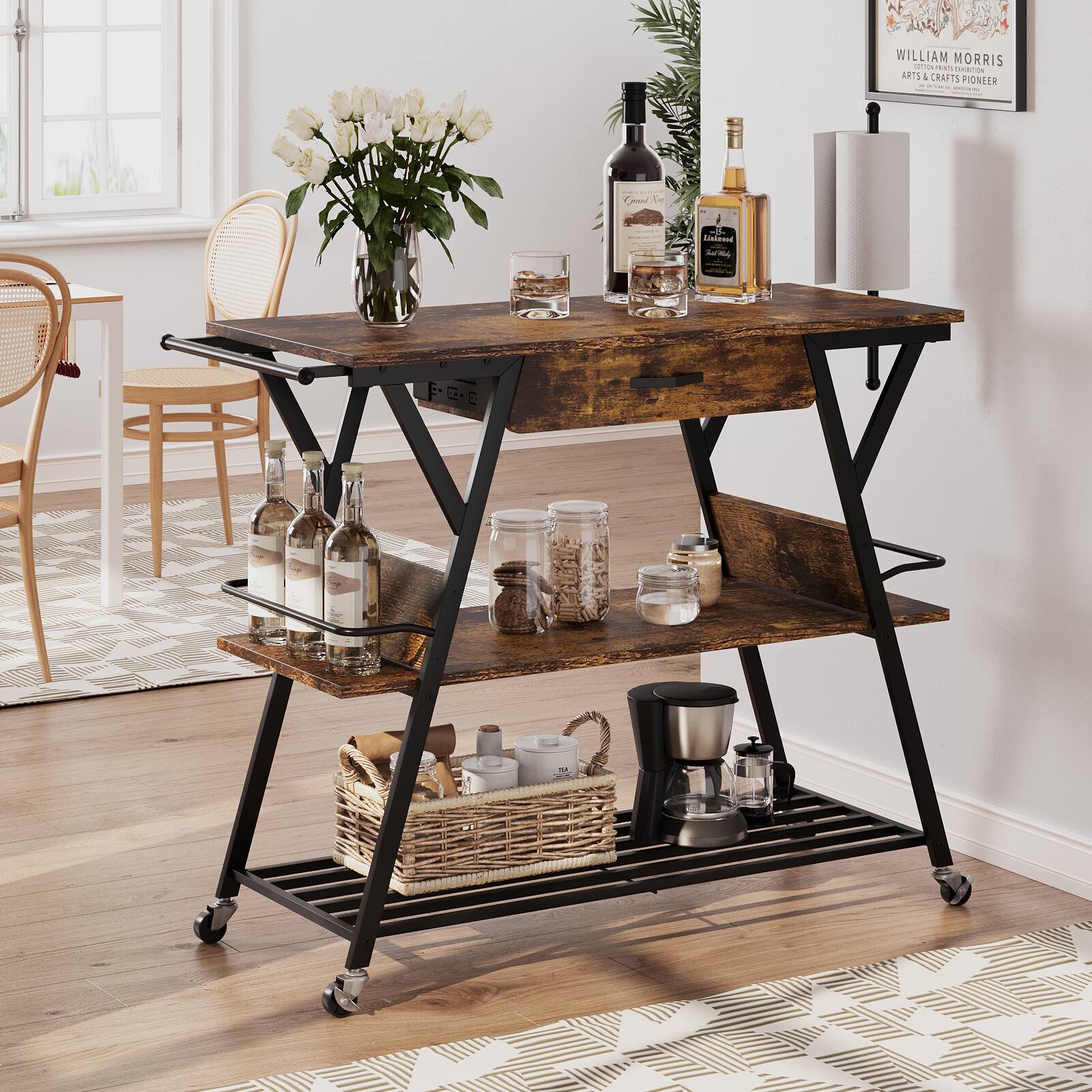 The image features a wooden table with a variety of items on it. There are several bottles, including a wine bottle, and a vase with flowers. The table also has a cup and a bowl on it. The table is positioned in front of a window, and there are chairs nearby. The scene appears to be a cozy and inviting living space.