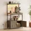 A coffee maker is on the shelf, along with a few other items.