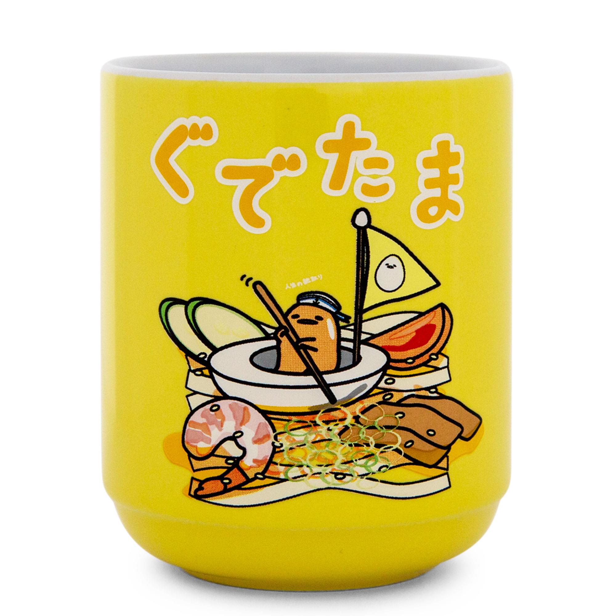 Front. Silver Buffalo - Sanrio Gudetama Sailing On Ramen Asian Ceramic Tea Cup | Holds 9 Ounces - Yellow.