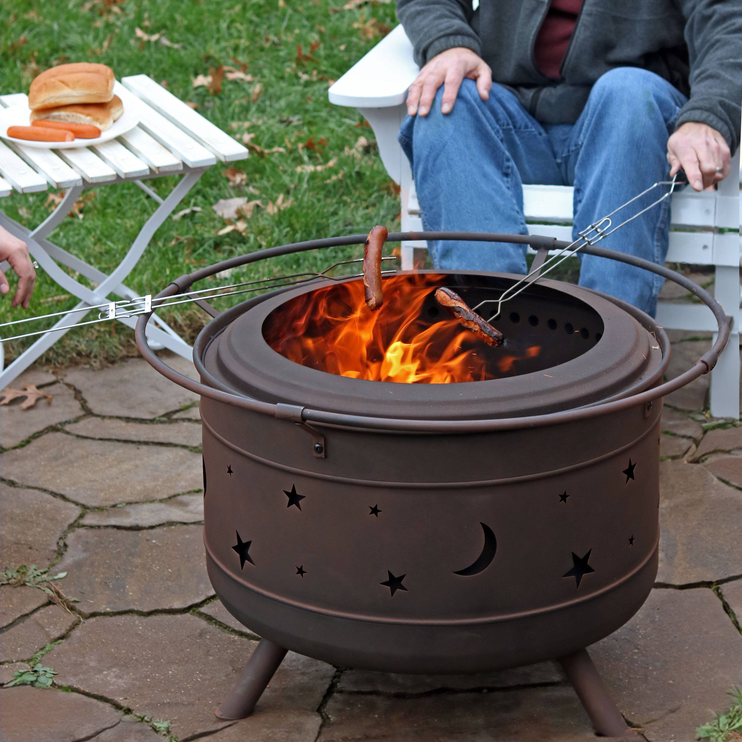 Alt View 4. Sunnydaze - 30 in Cosmic Steel Smokeless Fire Pit with Log Poker and Cover - Bronze.