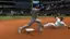 "2G W AAR W MLB shop.com DEGROM 5 TA THE SHOW TOGETHER GHEN 2 MARINERS" is a text that is displayed on the image. It is likely related to the baseball game being played, possibly indicating the players' names, positions, or team affiliations.