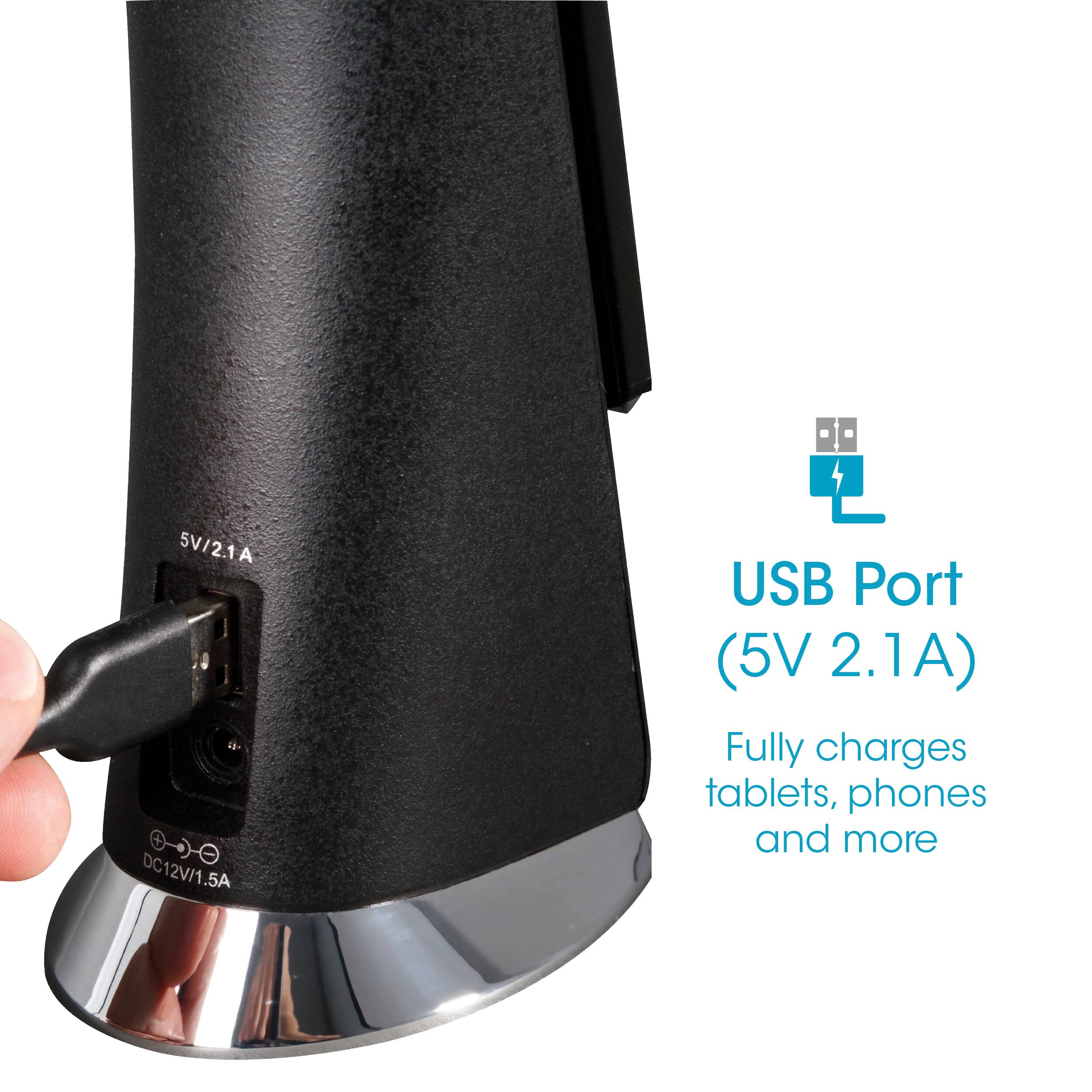 The image shows a hand plugging a device into a black USB port. The USB port is labeled with the text "5V/21A DC12V/1.5A .5A USB Port (5V 2.1A) Fully charges tablets, phones and more." This indicates that the USB port is capable of charging various devices, such as tablets and phones, at a voltage of 5V and a current of 2.1A. The port is designed to provide a reliable and efficient charging solution for a wide range of devices.