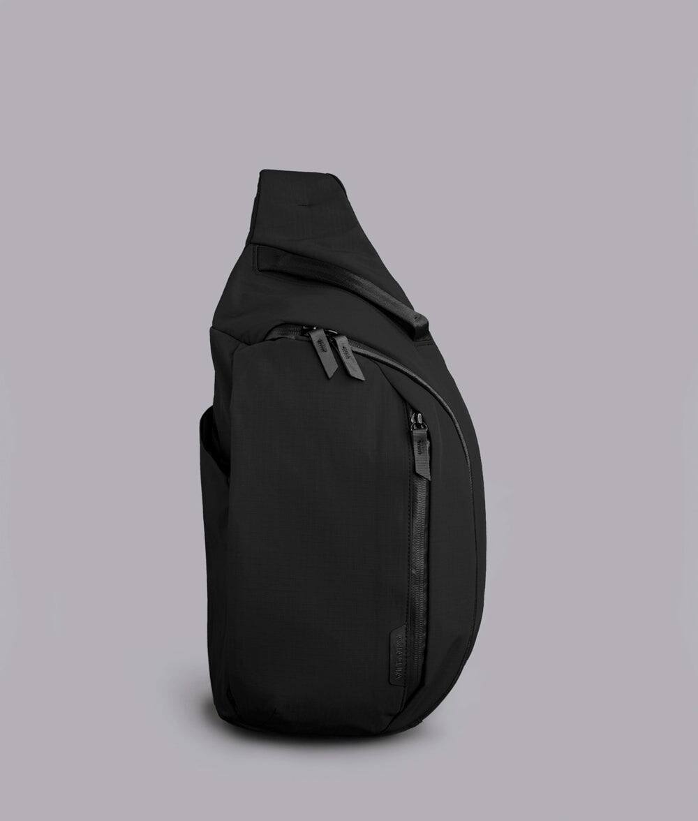 Alt View 4. ALPAKA - Metro Crossbody Left Shoulder Sling Bag Men,Sling Backpack - Fits 11" Tablet - Single Shoulder - Black Axoflux 210D.