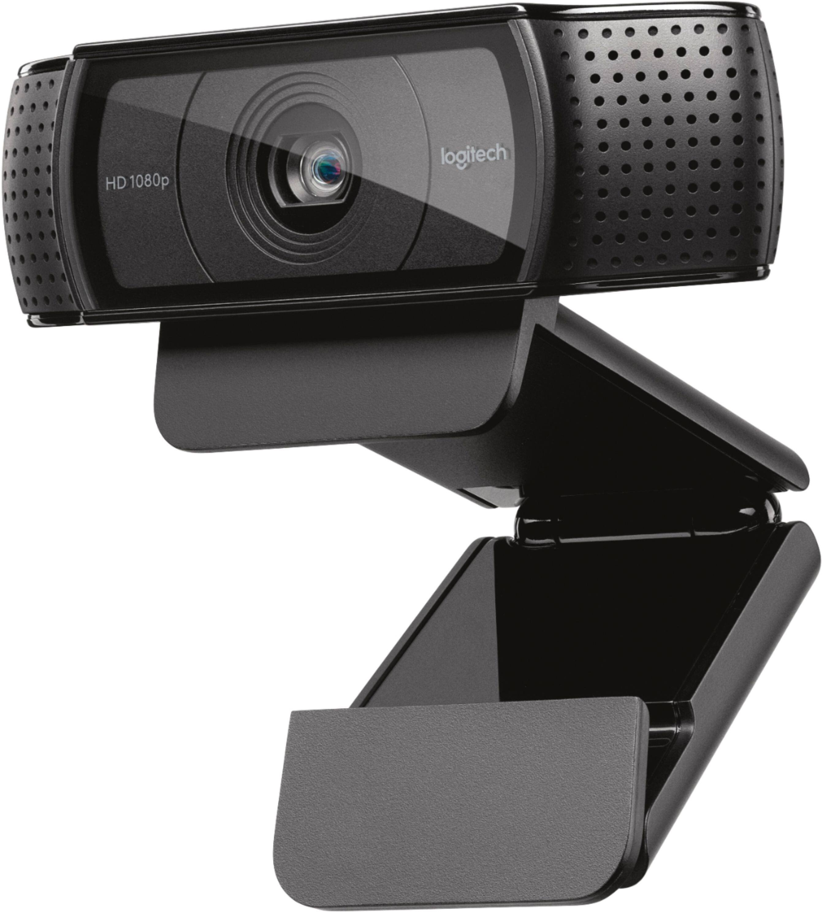 The image features a Logitech HD 1080 web camera, which is a high-quality video camera designed for use with computers. The camera is mounted on a black stand, which provides a stable and adjustable platform for the camera. The stand is equipped with a hinge, allowing the camera to be easily tilted and adjusted to capture the desired viewing angle. The web camera is ready to be used for video conferencing, online meetings, or other applications that require high-quality video and audio.