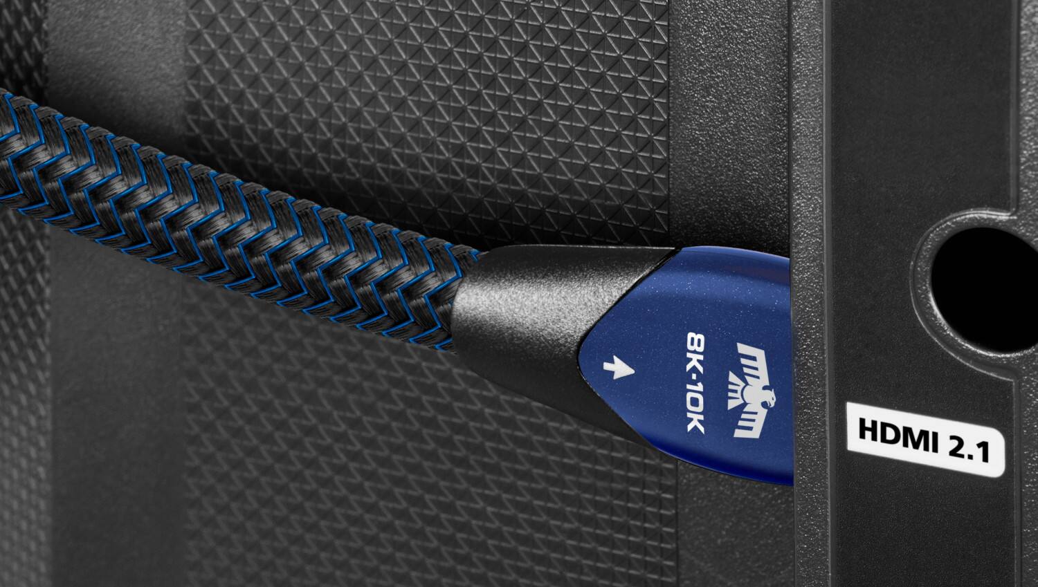 The text on the image reads "333 8K-10K W HDMI 2.1." This text is likely related to the HDMI cable and its specifications. The HDMI 2.1 refers to the latest version of the HDMI standard, which supports higher resolutions and faster data transfer rates. The "333" could be a reference to the cable's length, with 333 feet being the maximum length of the cable. The "8K-10K W" might refer to the cable's compatibility with 8K and 10K resolutions, indicating that it can support high-resolution displays.